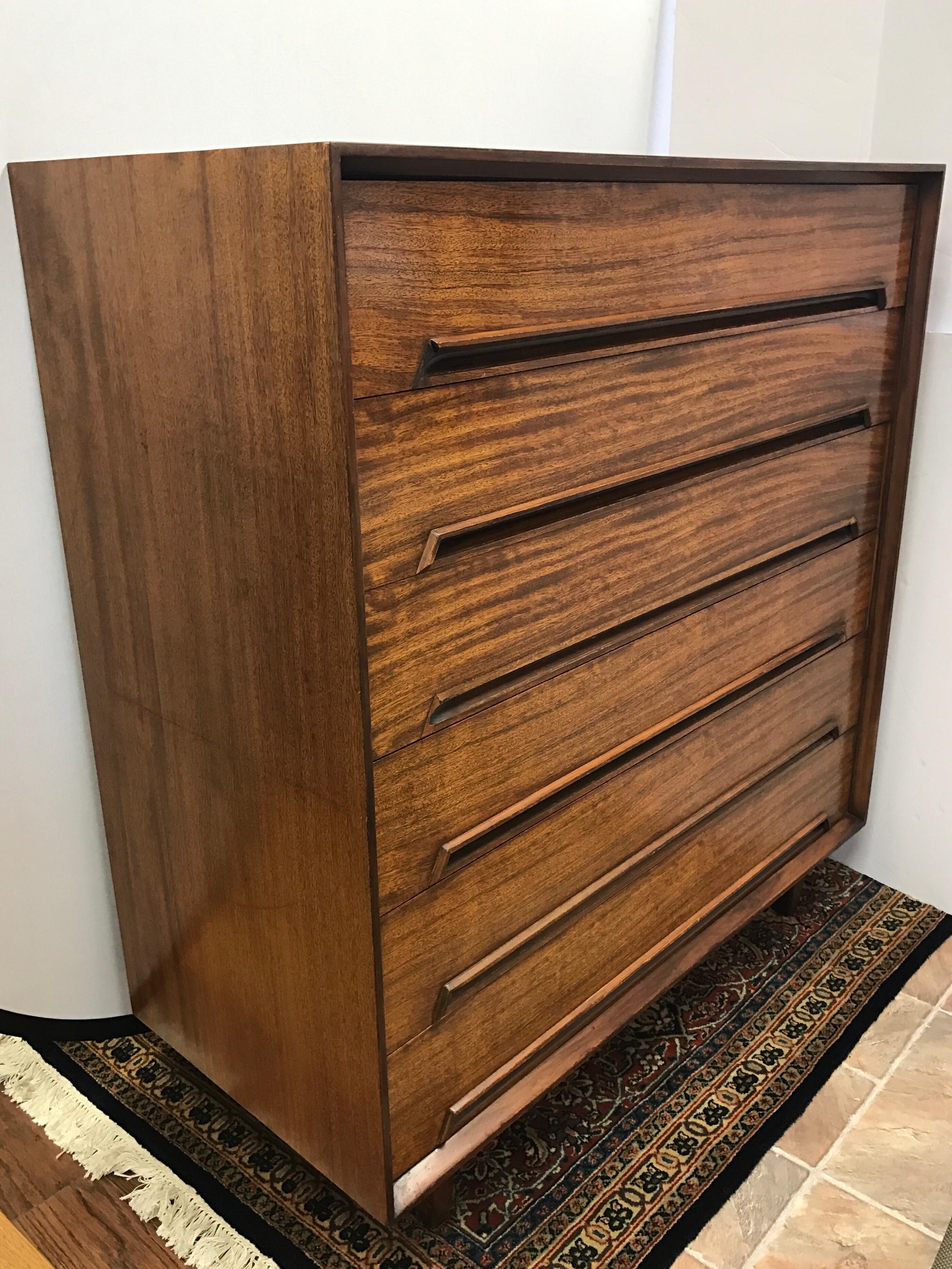 Rare Milo Baughman designed Drexel Perspective tall five-drawer chest of drawers. This mahogany and rosewood chest of drawers is an early Milo Baughman design. The lines are spectacular and we also have the matching lower chest and bed in other