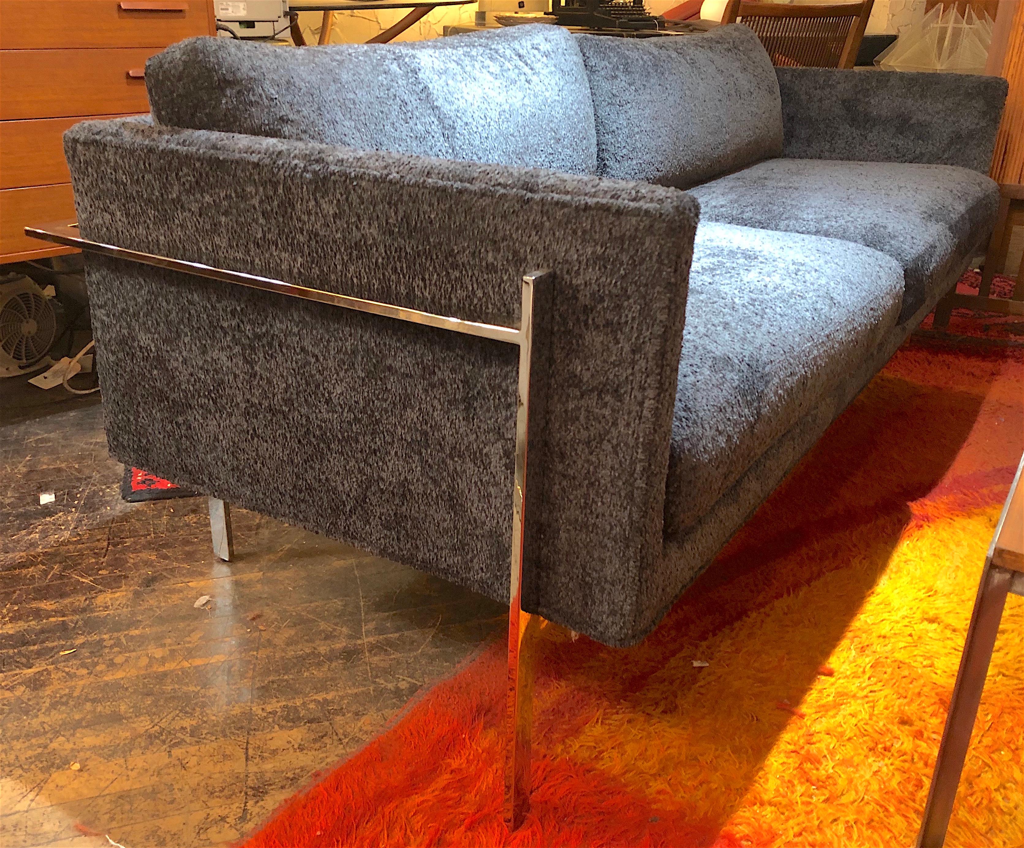 Designed by Milo Baughman in 1968, the Drop In sofa is a timeless, classic modern sofa, with striking good looks from every angle. Polished steel bar running around the sofa and down the legs. Covered in a shag deep blue fabric.
Please confirm