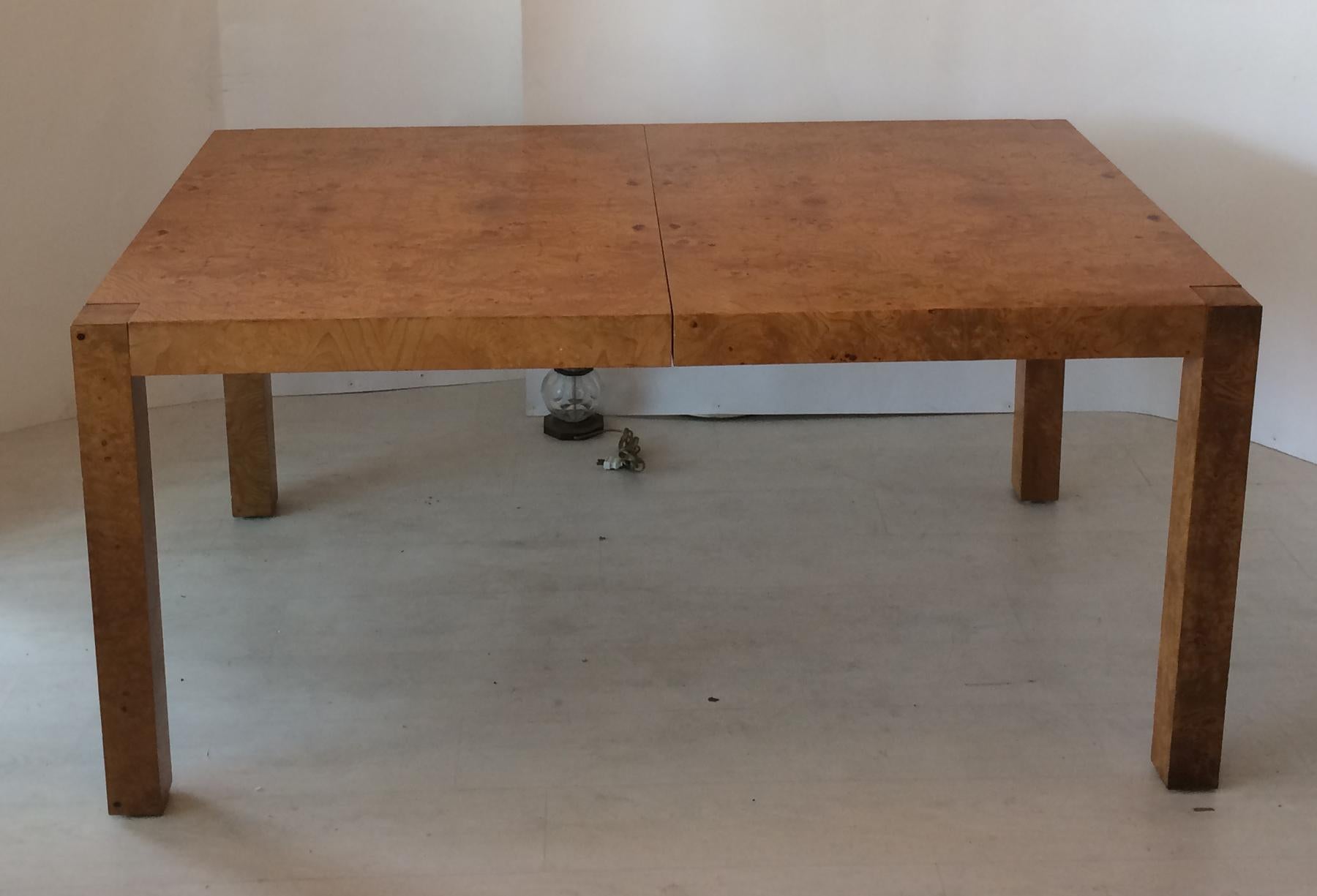 Table was originally designed by Milo Baughman for Dillingham Manufacturing Company. After lane bought Dillingham they continued to manufacture this design under the Lane Furniture name. Comes with two 18 inch leafs. Leaves are a little darker in
