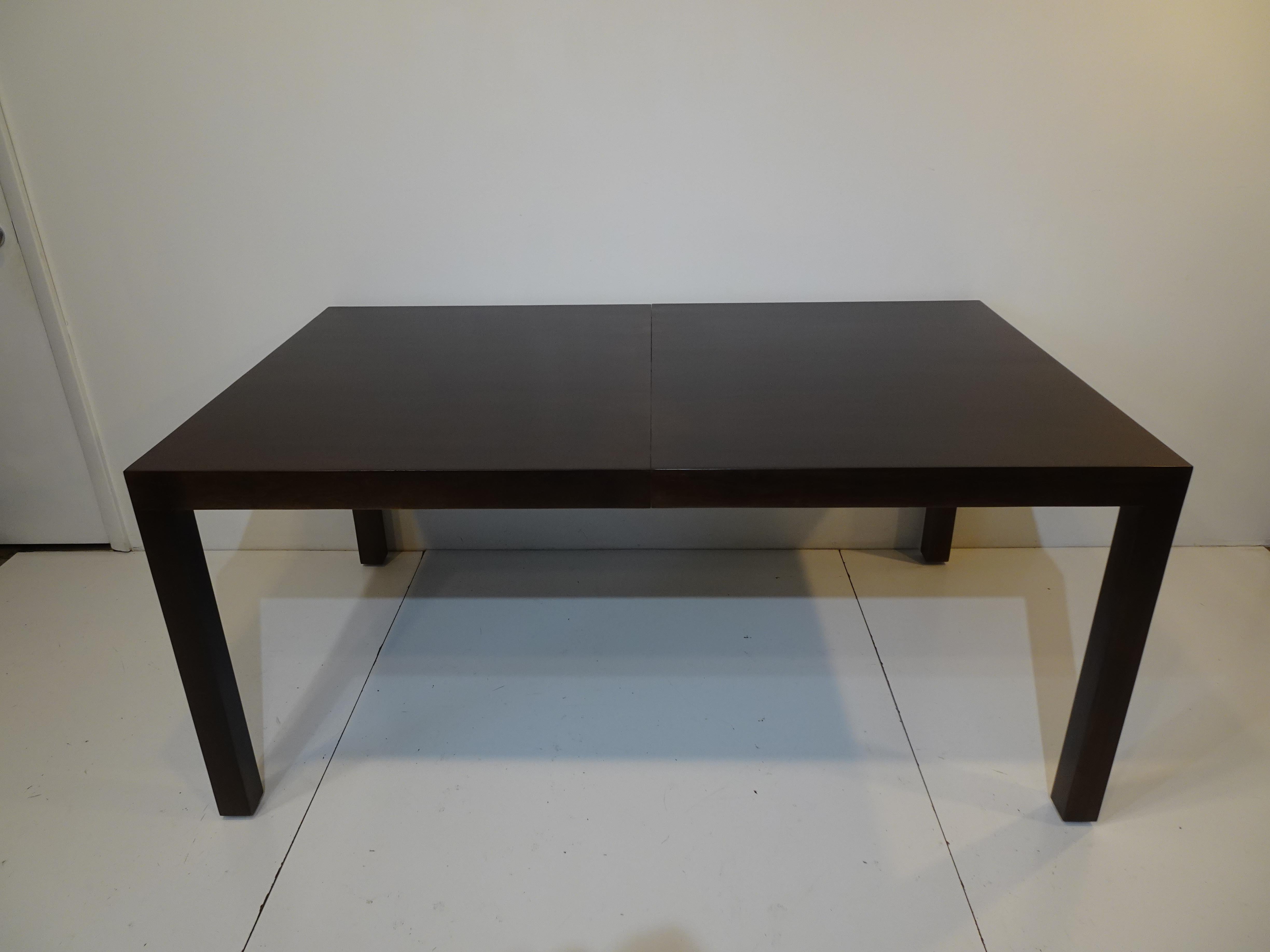 A parson styled dining table with three 15