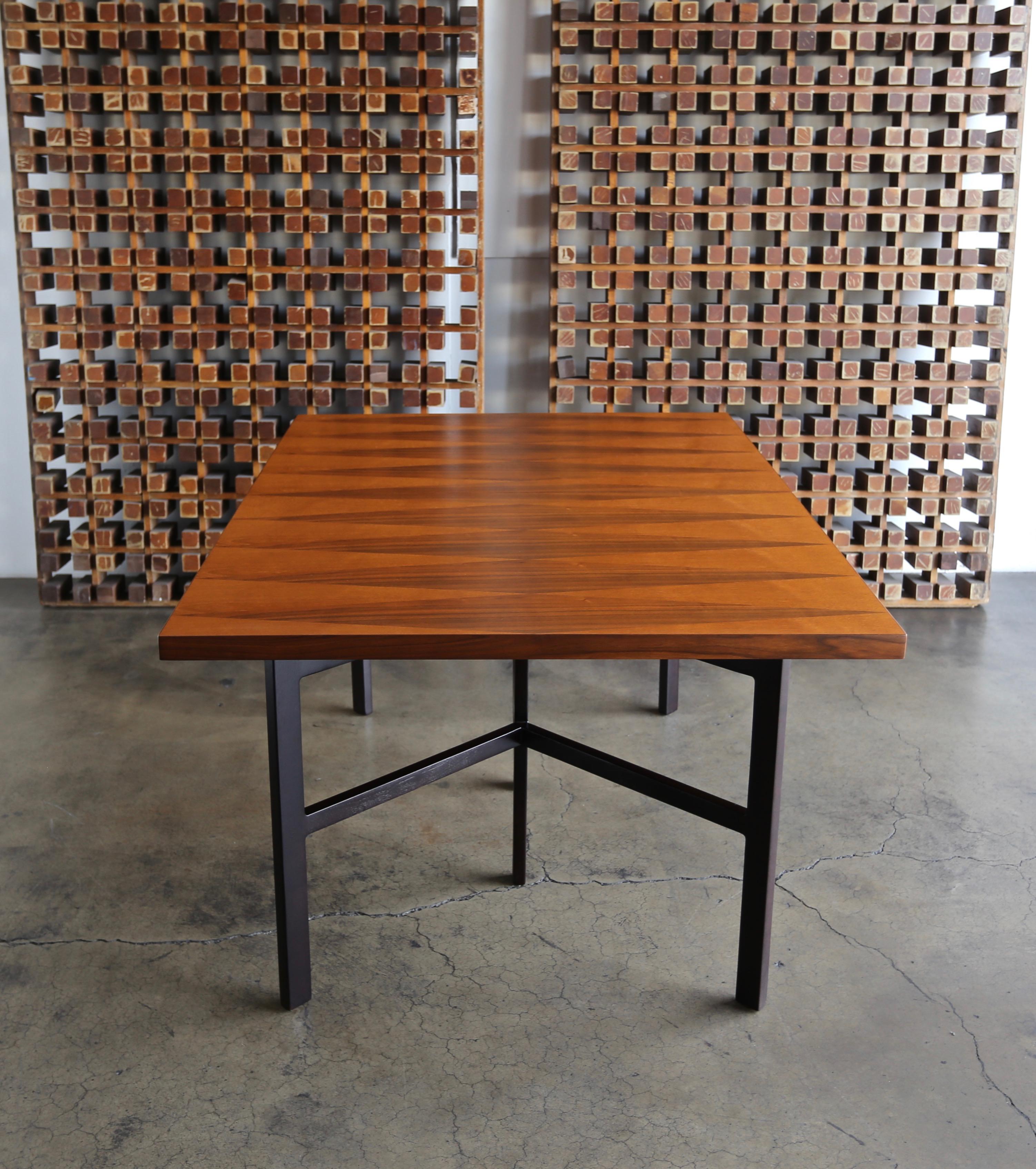 Milo Baughman dining table for Directional Furniture circa 1960. Diamond shaped walnut and teak inlay to the top. This piece has been professionally restored. 

This table extends up to 90 3/8