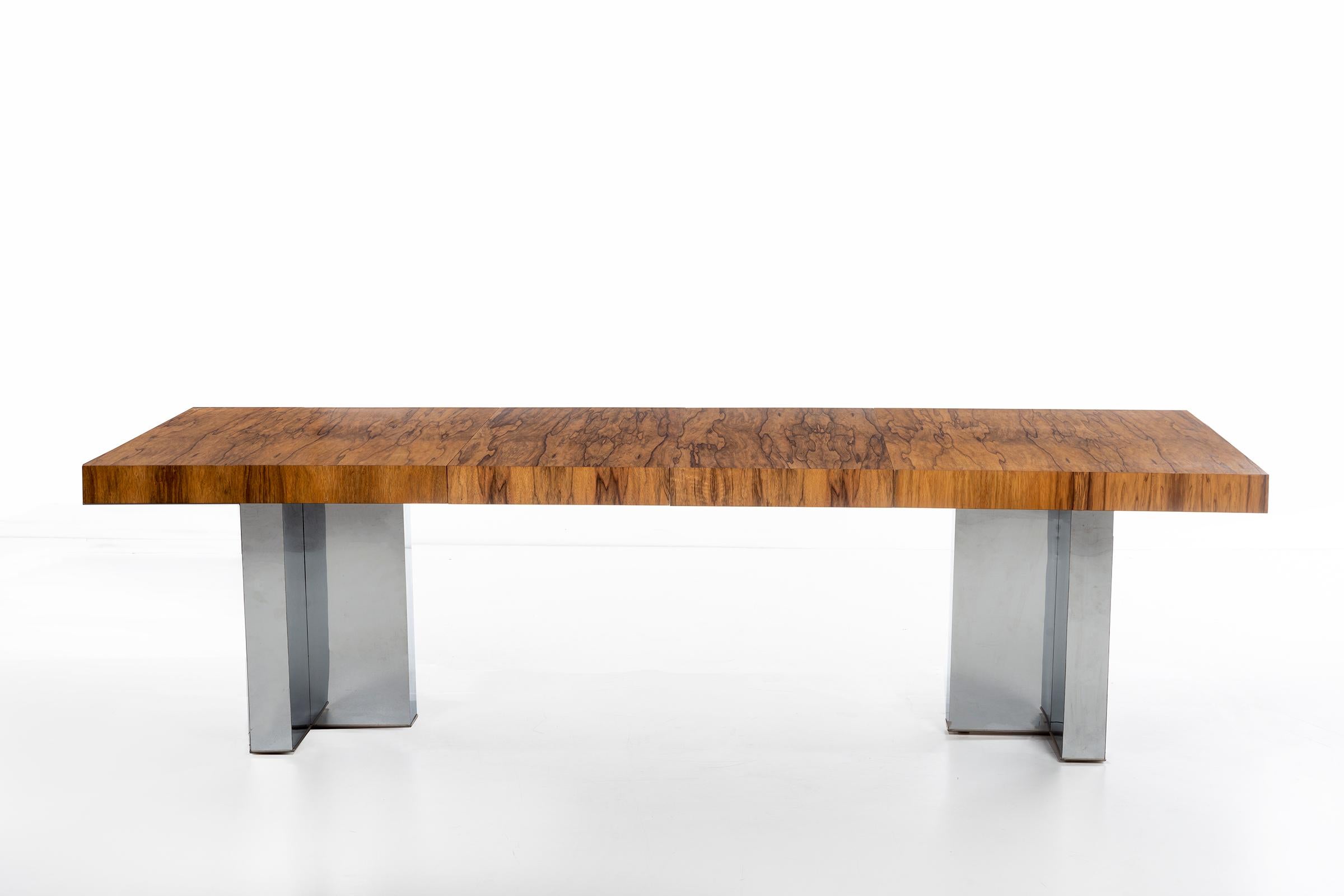 Milo Baughman for Thayer Coggin. Rosewood top with chrome legs. With two leaves the table extends to 98