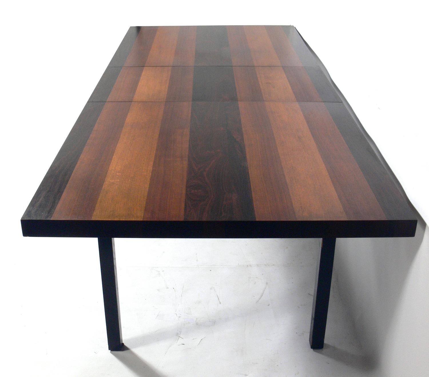 Clean lined modern dining table with beautifully grained mixed woods, designed by Milo Baughman for Directional, American, circa 1960s. Retains it's warm original patina. It comes with one 20