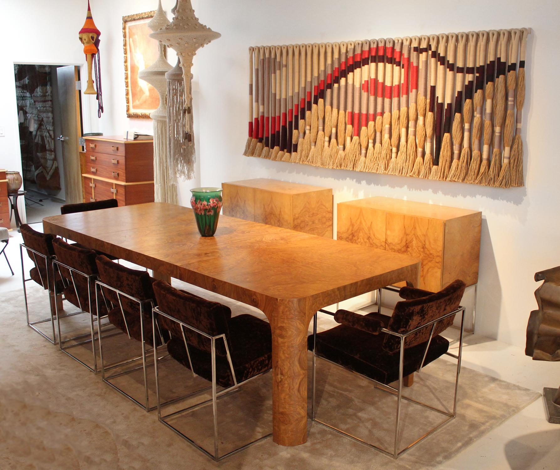 Magnificent bookmatched burl wood Parsons table with two leaves designed by Milo Baughman and produced by Thayer Coggin. An extraordinary design by one of the masters of 20th century modernism.

The table measures 42 W x 66