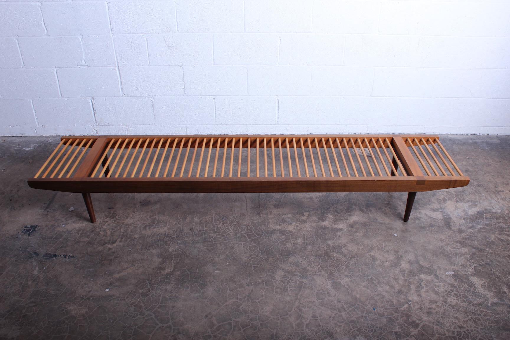 A maple and walnut dowel bench designed by Milo Baughman for Glen of California.