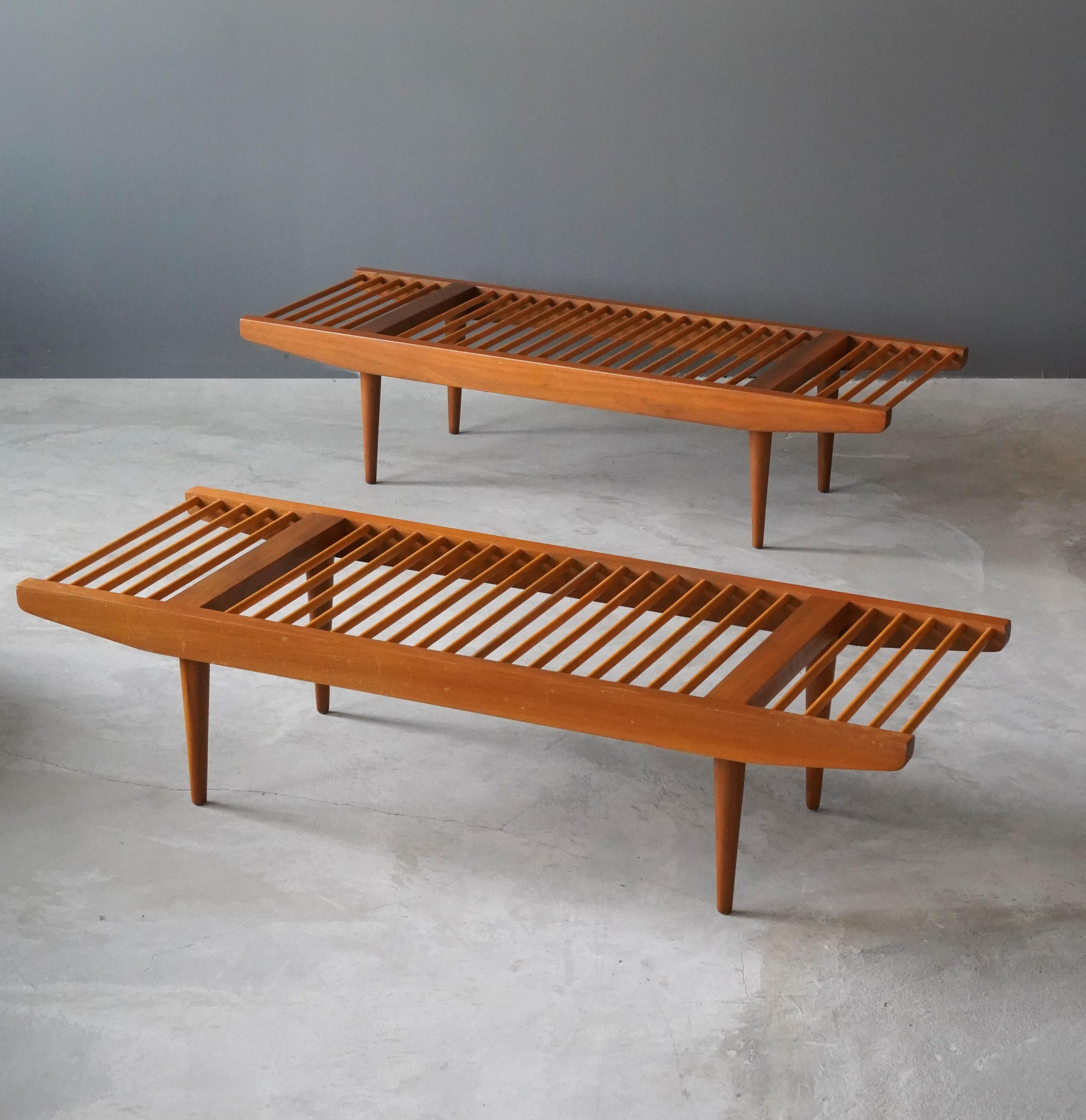 A pair of benches, designed by Milo Baughman for Glenn of California. Circa 1952. In solid walnut.

Other designers of the period include Edward Wormley, Paul Frankl, George Nakashima, Isamu Noguchi, and T.H. Robsjohn-Gibbings.