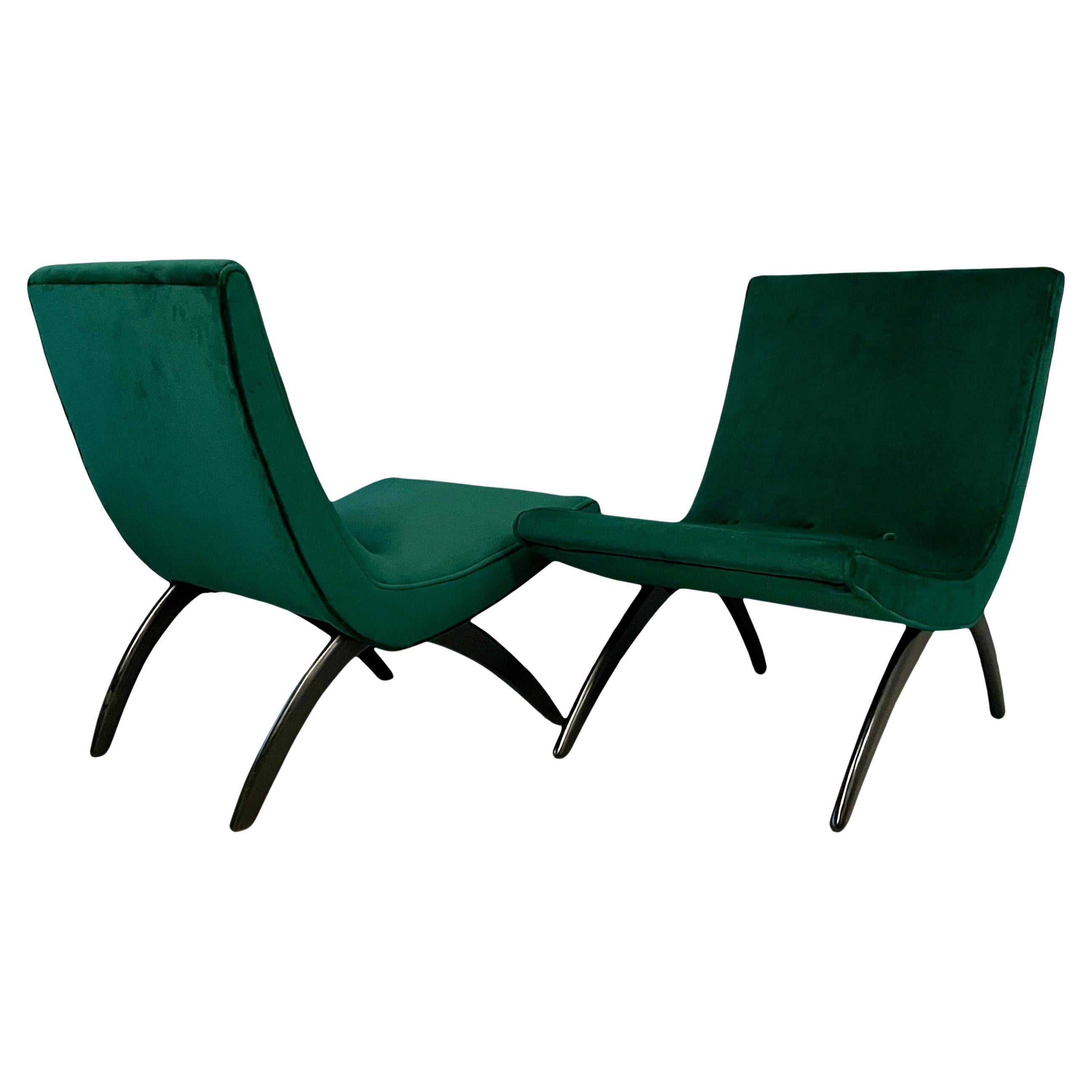 Iconic and early scoop chairs with ebonized walnut legs and newly reupholstered in a beautiful emerald green velvet makes this pair of chairs spectacular! This is a chair that you don't see very often.