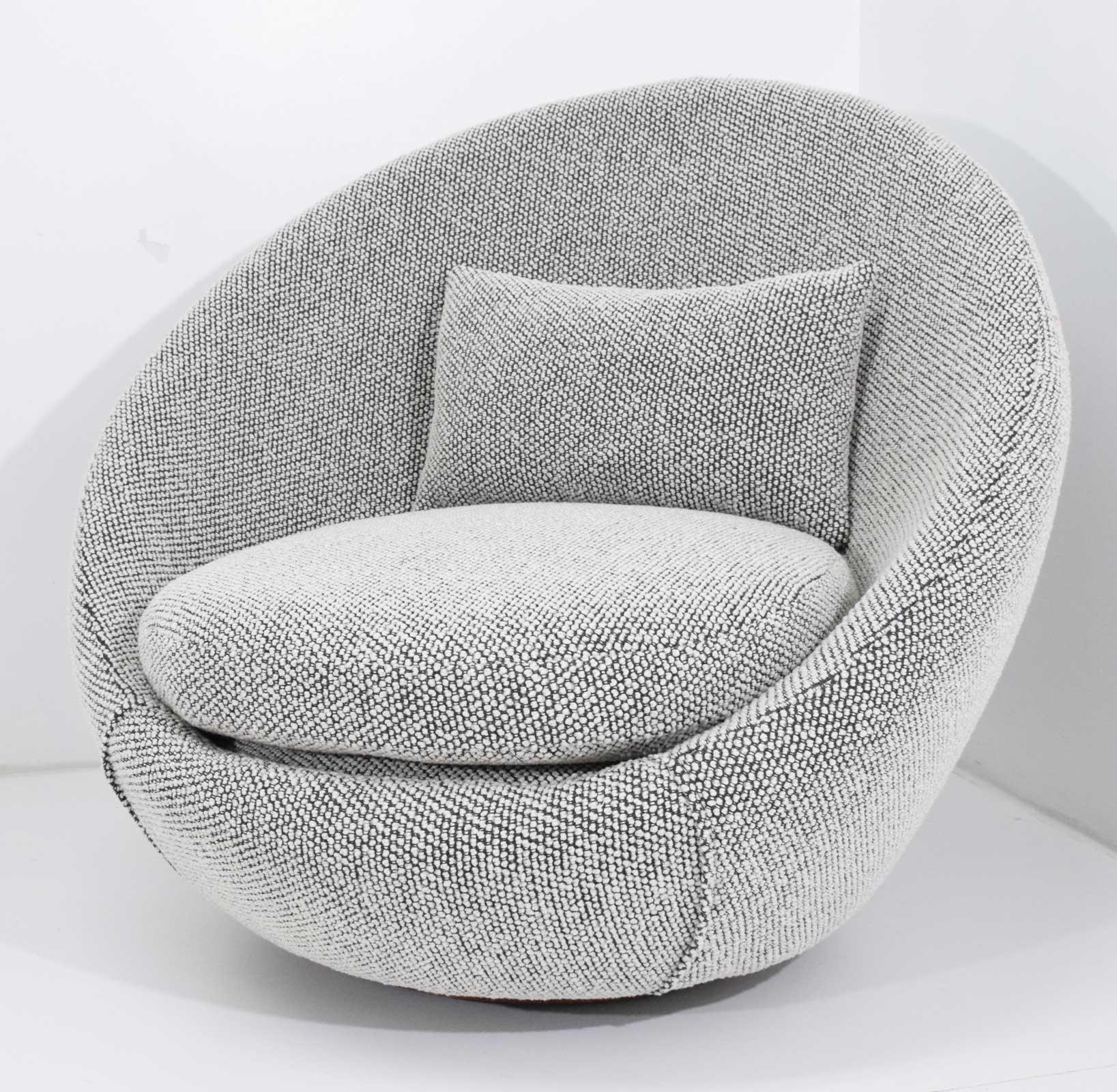 We have updated this chair in new fabric. A nubby and soft black and white wool.