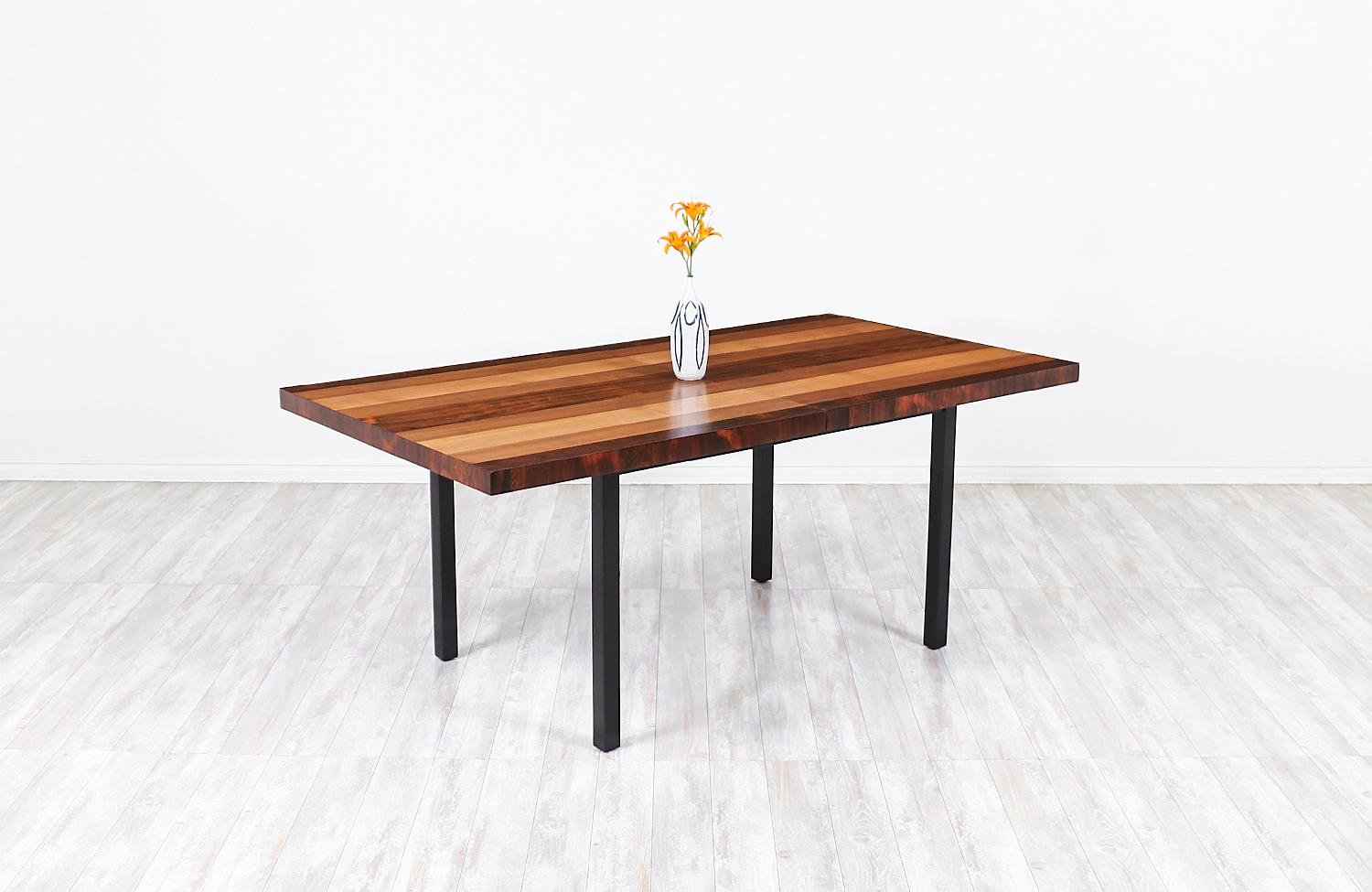 Milo Baughman expanding multi-wood dining table for Directional

Dimensions
29.5in H x 72in-112in W x 39in D
2x leaves - 20in each.