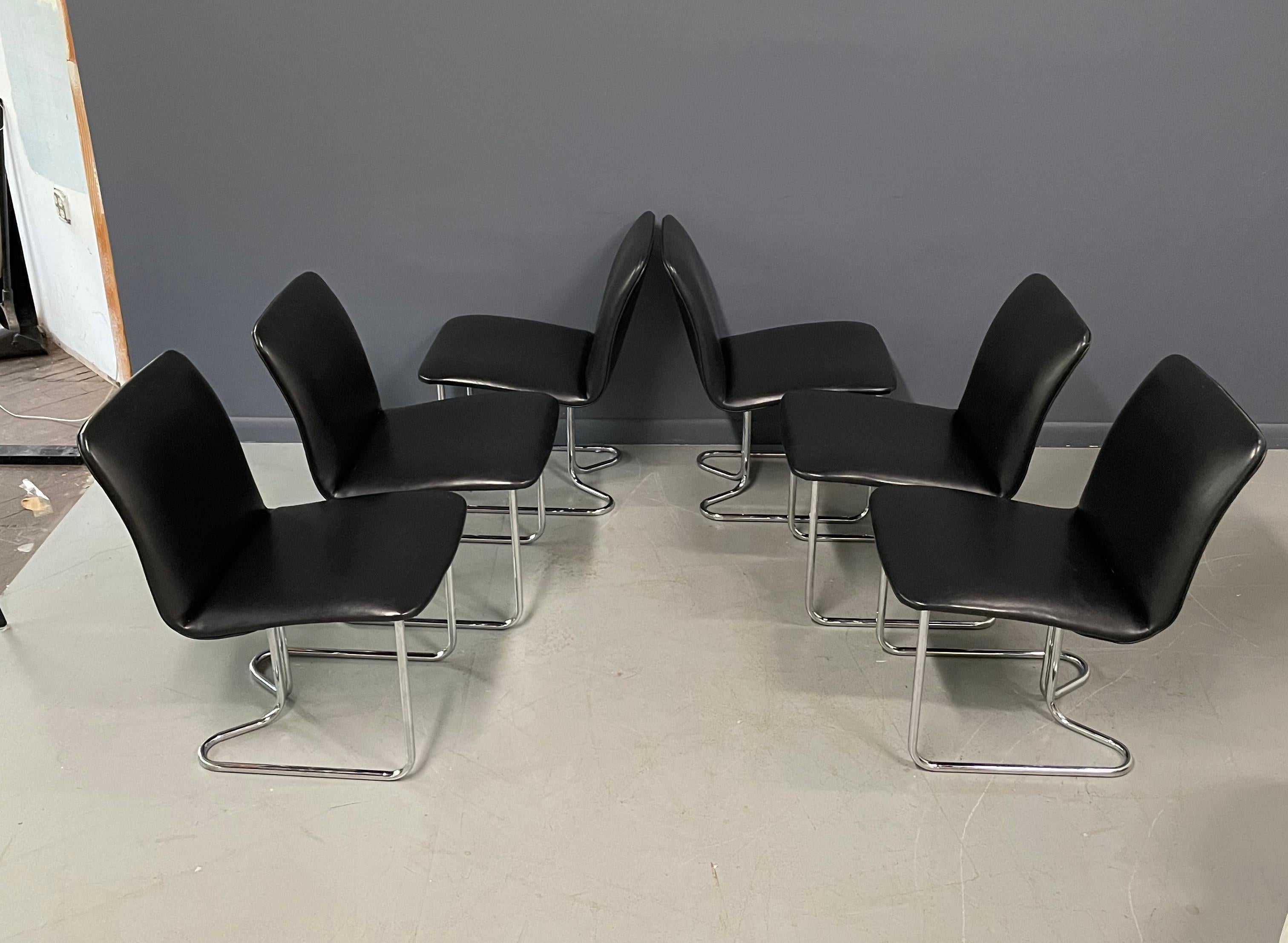 Very difficult to find, these provocative dining chairs are in wonderful condition, the chrome is bright and the upholstery is in fine shape. We do offer upholstery service if black isn't your thing.