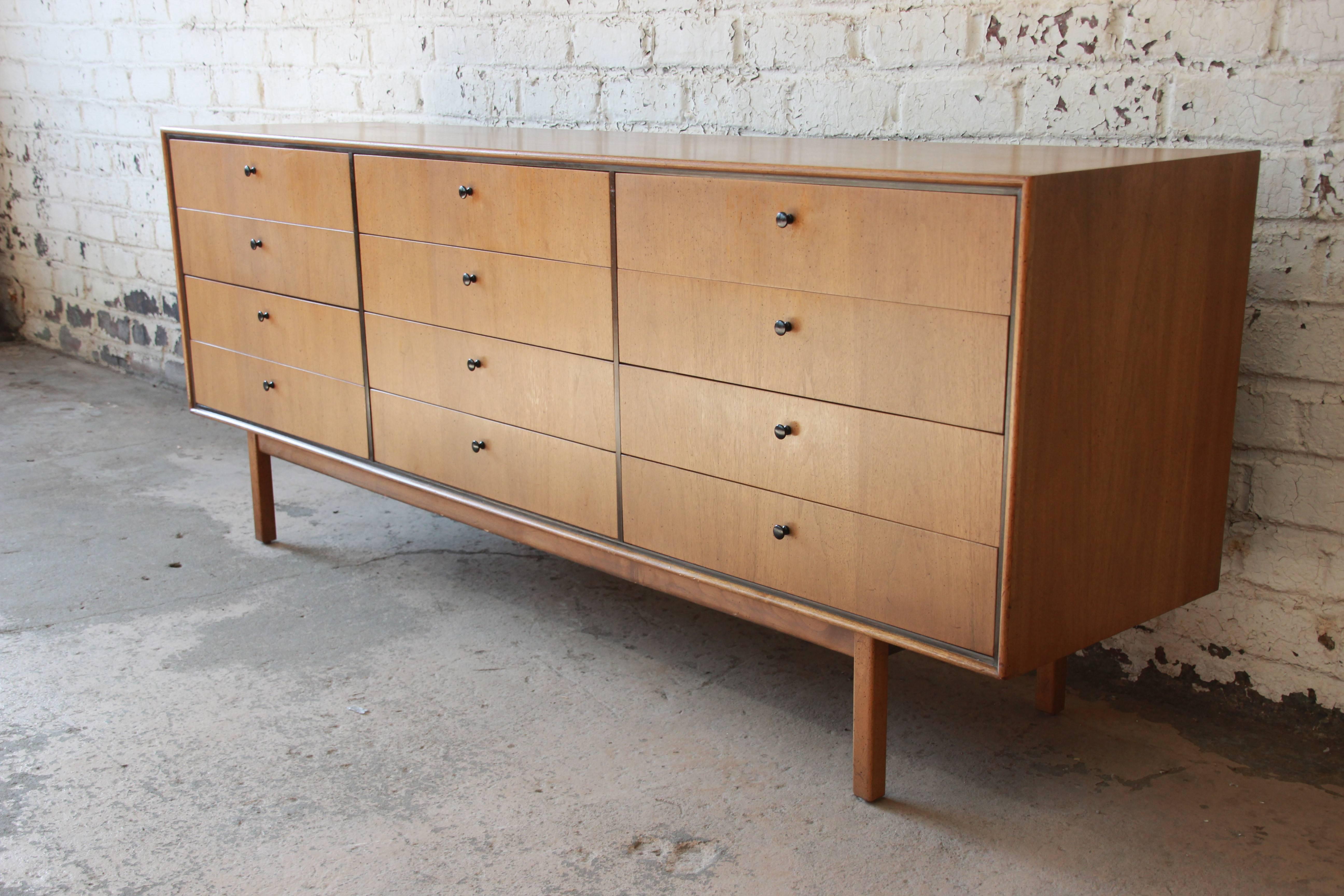 A rare and exceptional Mid-Century Modern long dresser or credenza designed by Milo Baughman for Arch Gordon. The dresser features gorgeous bleached walnut wood grain, with book-matched wood grain on the drawer fronts and black trim. It offers ample