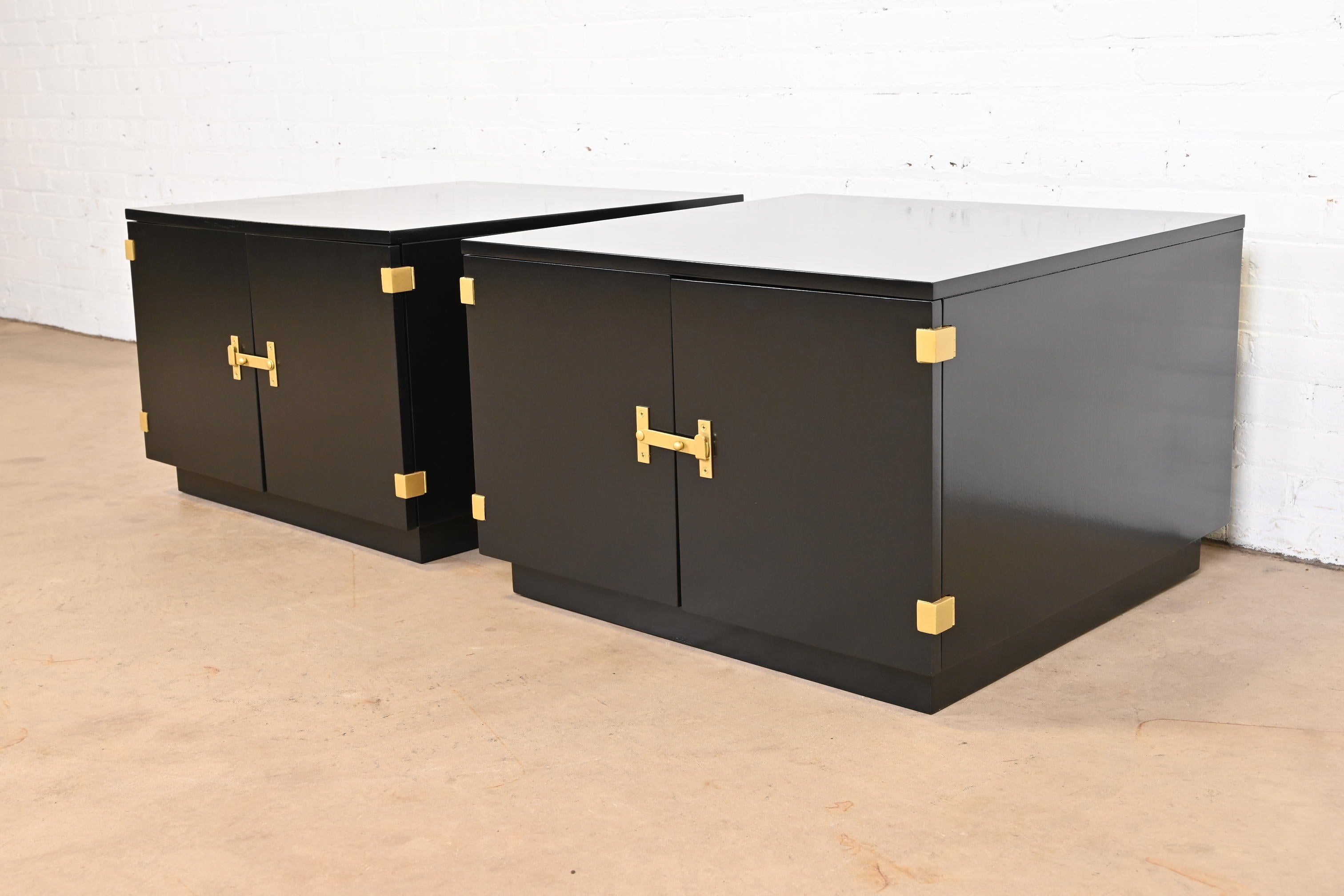 An exceptional pair of Mid-Century Modern large nightstands or side tables

By Milo Baughman for Directional

USA, 1960s

Black lacquered walnut, with brass finished accents and hardware.

Measures: 30