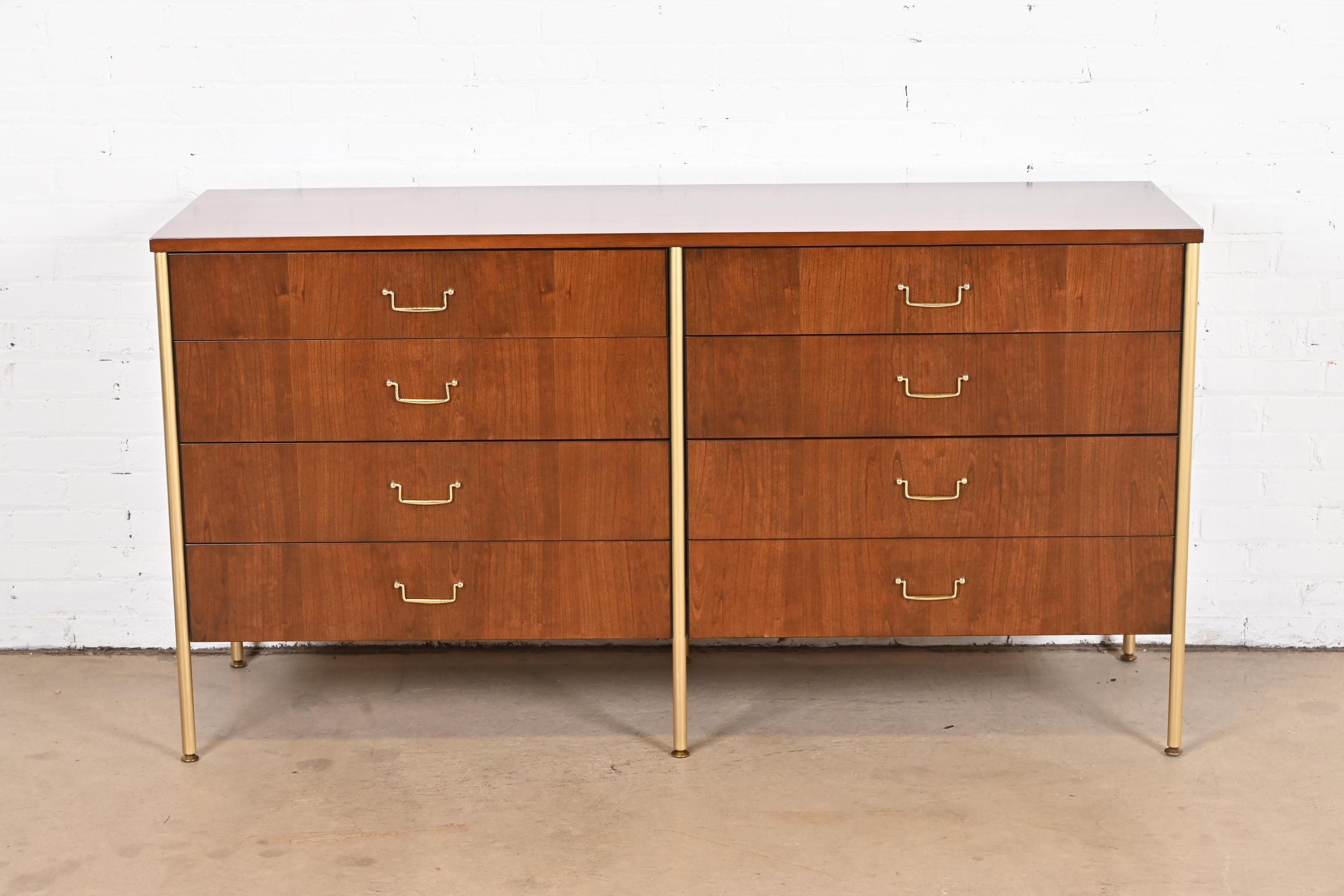 A rare and exceptional Mid-Century Modern double dresser or credenza.

By Milo Baughman for Directional and produced by Calvin Furniture.

USA, 1960s

Gorgeous book-matched cherry wood, with brass legs and hardware.

Measures: 64