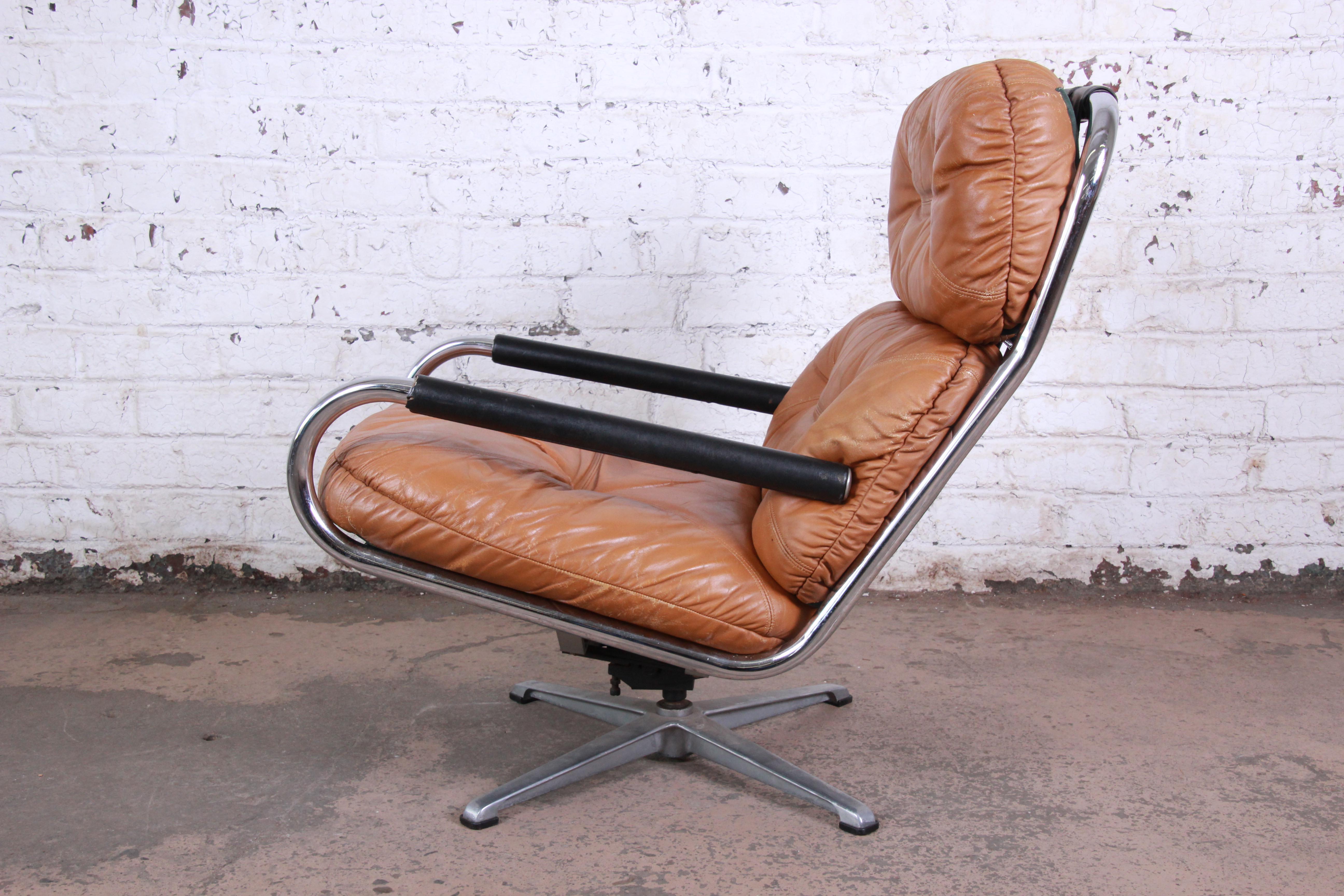 A gorgeous mid-century modern chrome and leather lounge chair designed for Directional. The chair features a polished chrome frame and beautiful tufted brown leather upholstery. An extremely comfortable chair and a nice alternative to the Eames