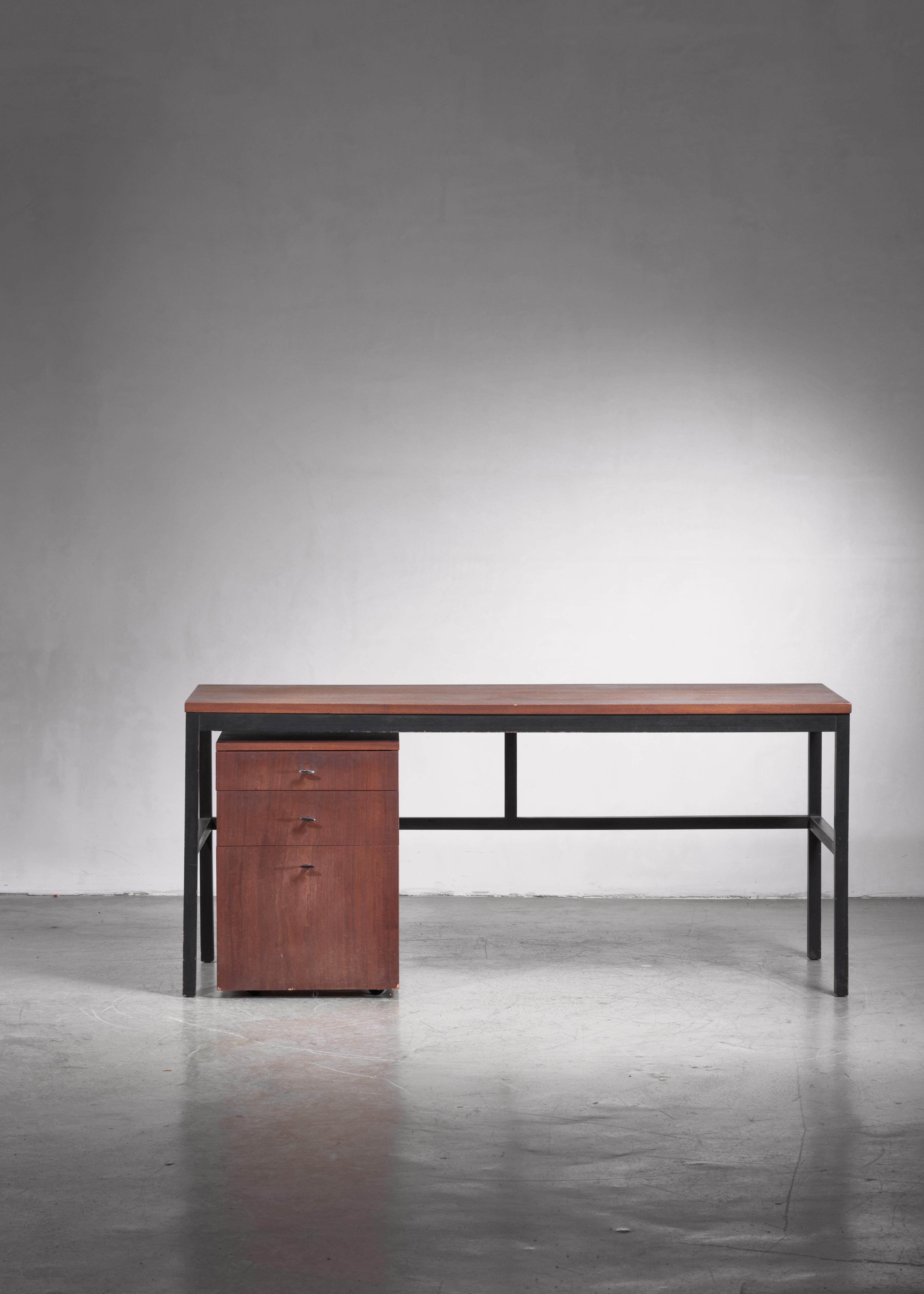 A Milo Baughman desk annex console table, with a free standing chest of drawers on wheels, for Directional Furniture.

 Without the cube with the drawers, the table can also function as a console table.
The desk is made of a walnut top on an