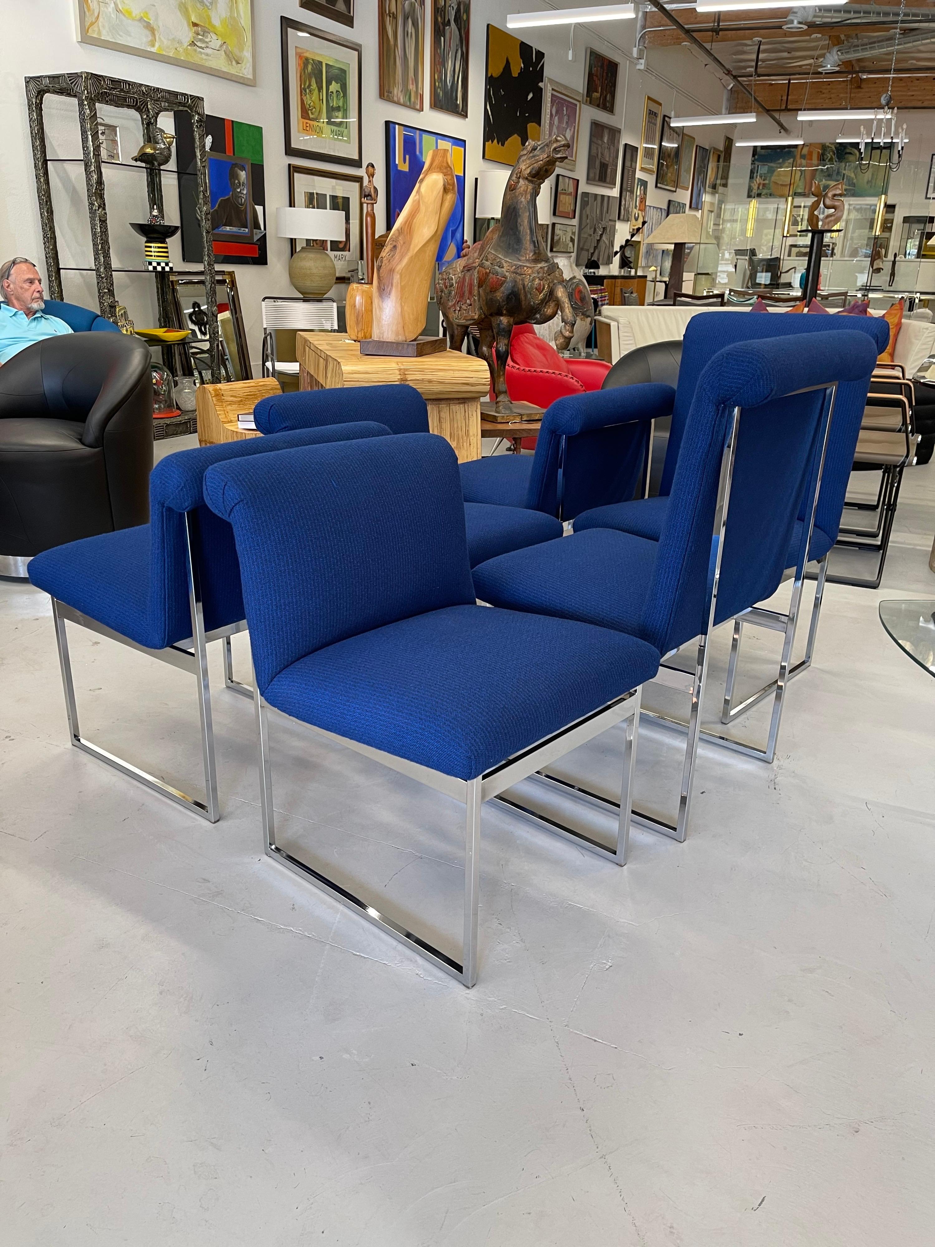 A set of 6 beautiful dining chairs in royal blue wool with chrome legs, attributed to Milo Baughman for Thayer Coggin. 2 of the chairs are high back at 37.5 inches tall and the other 4 are 29.5 inches tall. they are the same in all other dimensions.