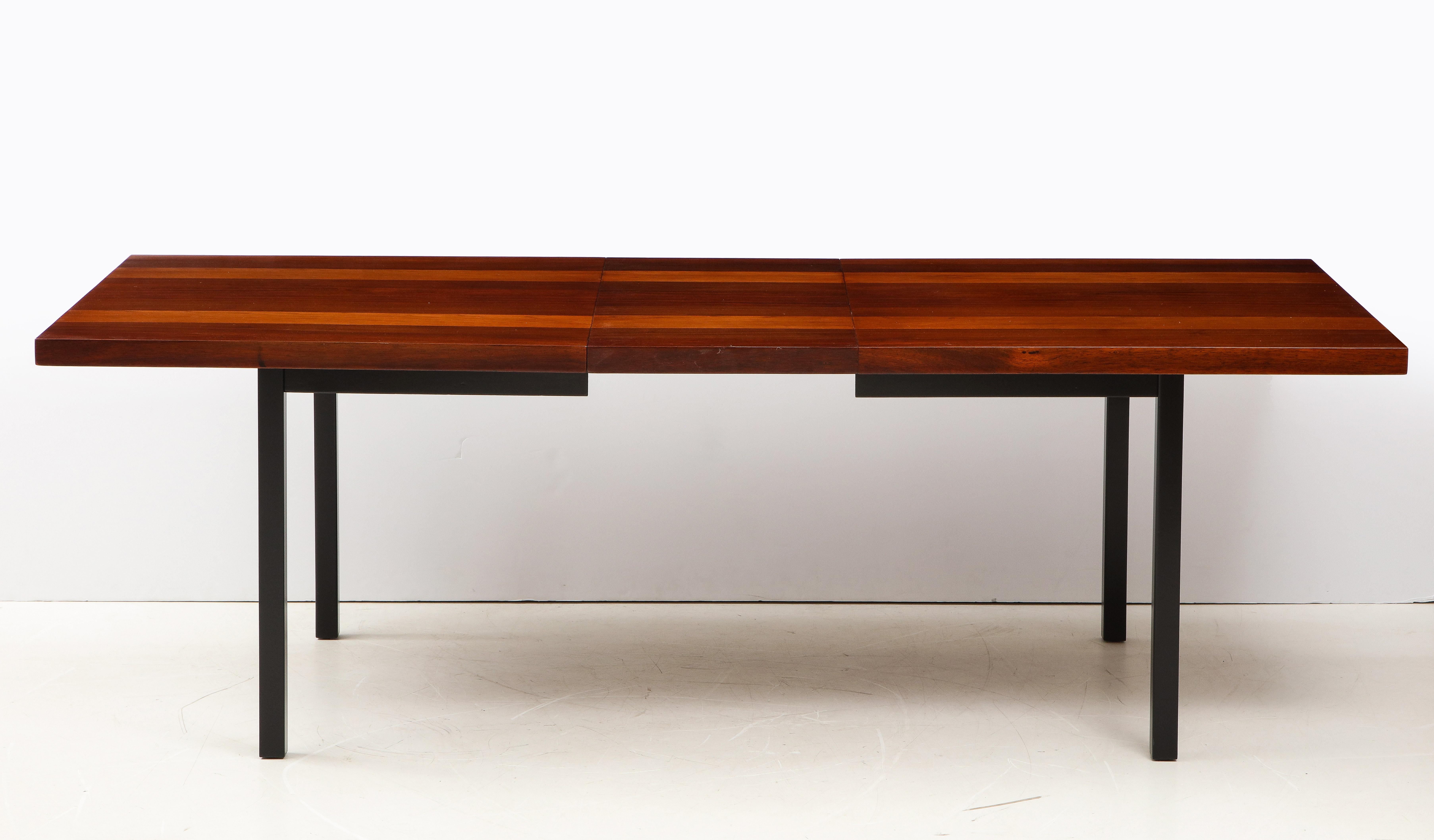 Stunning 1960's Mid-Century Modern mix wood dining table designed by Milo Baughman for Directional, fully restored with minor wear and patina due to age and use.

Length without the leaves is: 72''.

 