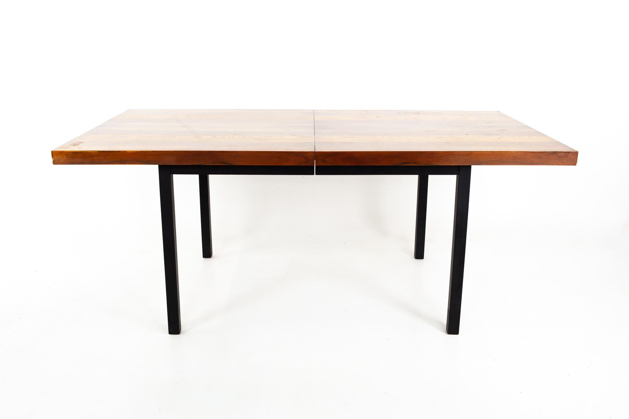 Milo Baughman for Directional Mid Century rosewood walnut and oak parsons dining table

Table measures: 72 wide x 39 deep x 29.25 inches high; each of the two leaves measure 18 inches wide for a total table width of 108 inches

This piece is