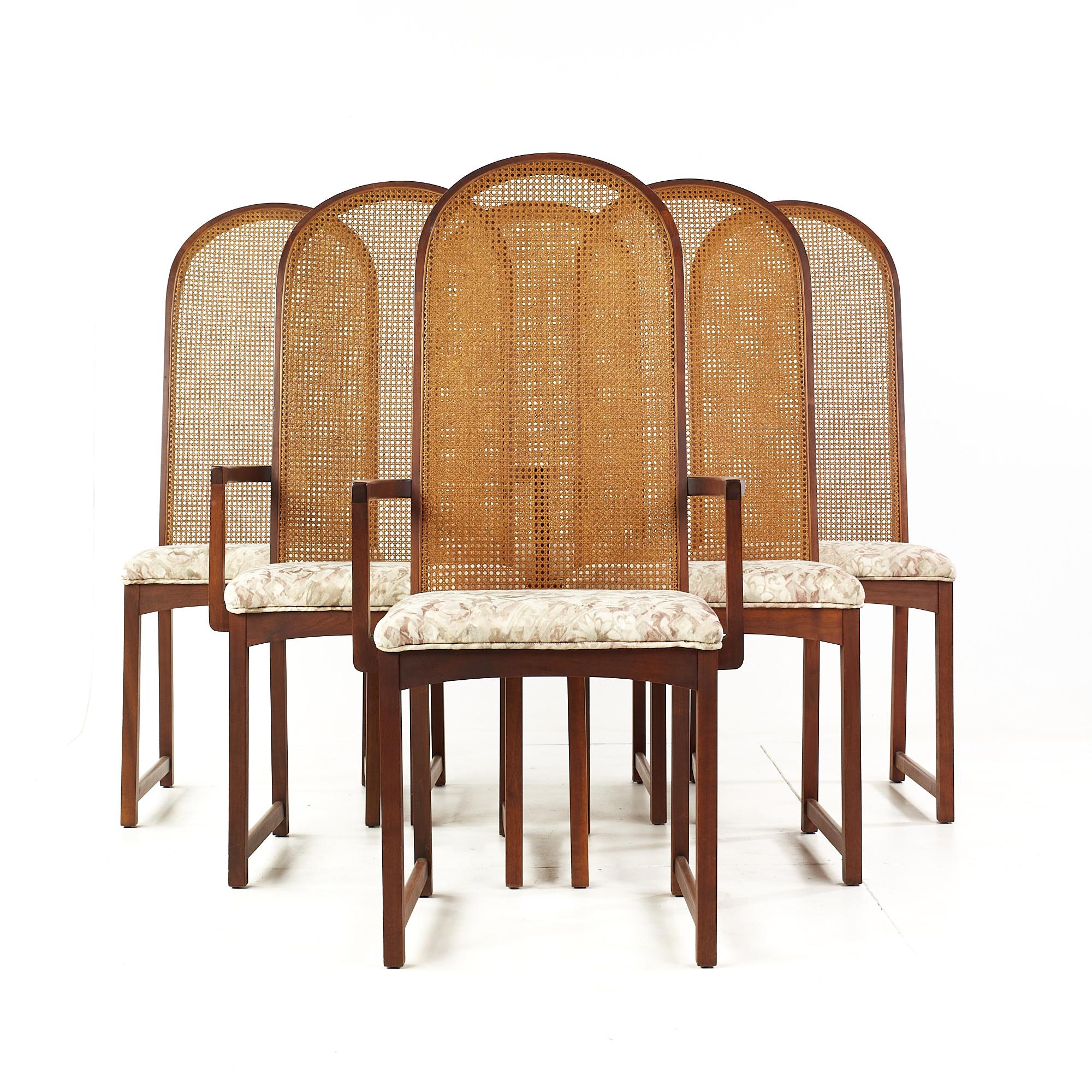 Milo Baughman for Directional Mid Century Walnut and Cane Back Dining Chairs - Set of 6

Each armless chair measures: 18 wide x 25 deep x 44.5 high, with a seat height of 18.5 inches
Each captains chair measures: 22 wide x 25 deep x 44.5 high, with