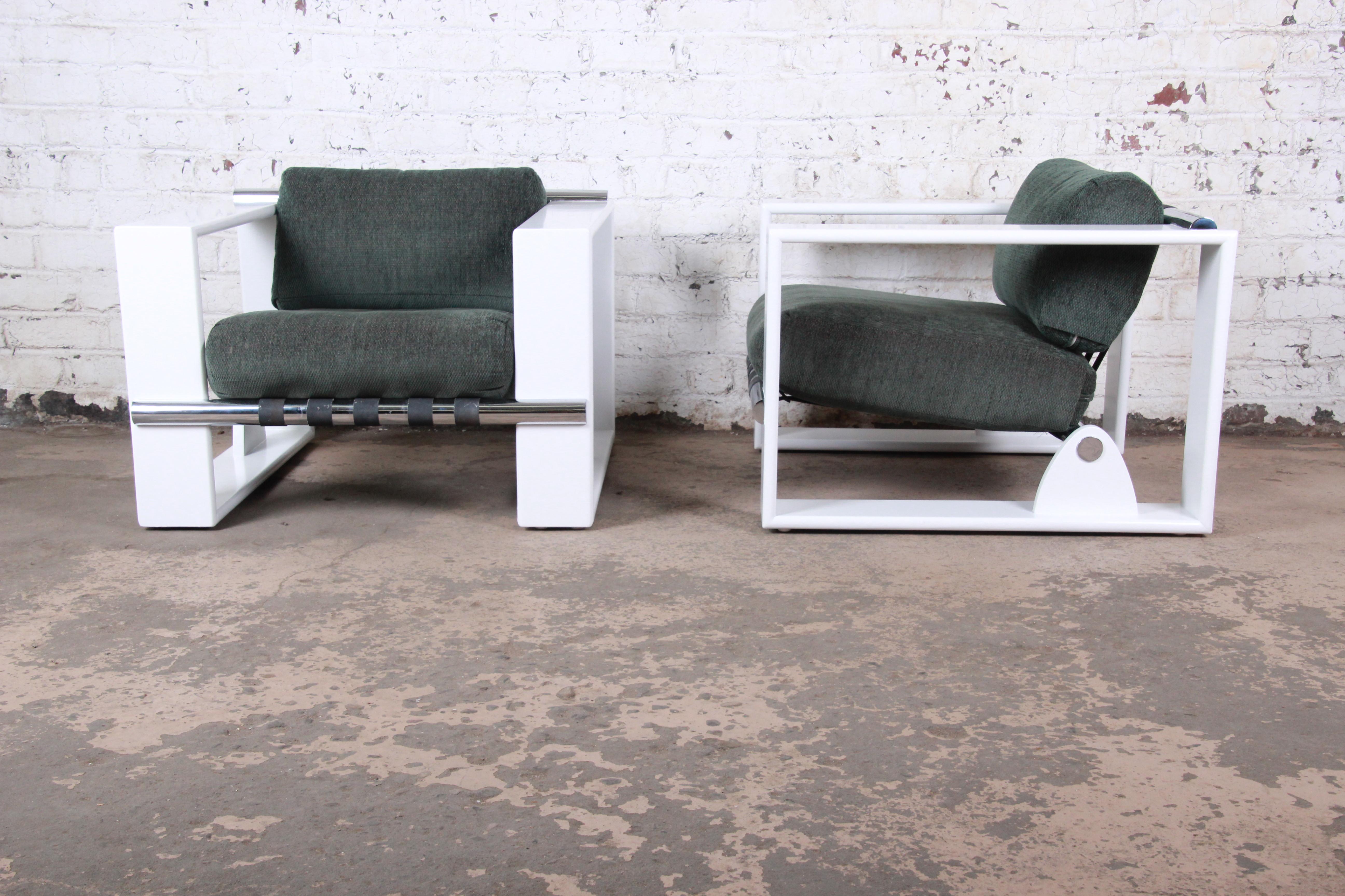 An exceptional pair of Mid-Century Modern cube lounge or club chairs

Designed by Jonathan Ginat for Directional

USA, 1970s

Lacquered wood and chrome and upholstery

Measures: 35.13