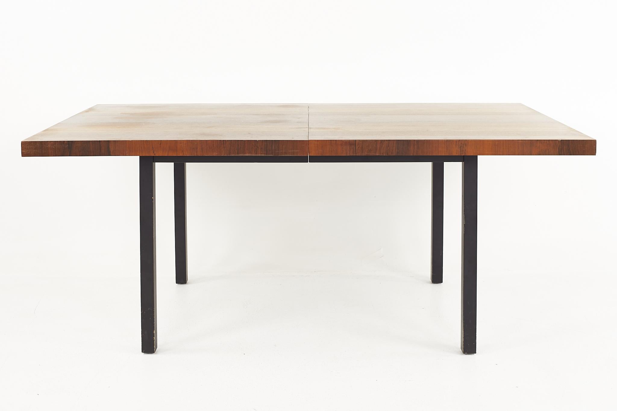 Milo Baughman for Directional mid century multi-wood dining table

This table measures: 60 wide x 38 deep x 28.75 high, with a chair clearance of 25.75 inches, each leaf measures 20 wide, making a maximum table width of 100 inches when both leaves