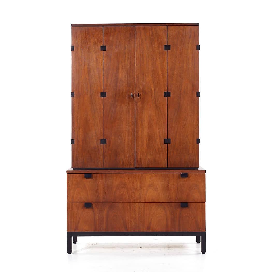 Milo Baughman for Directional Mid Century Walnut Armoire Wardrobe

This armoire measures: 40 wide x 18 deep x 66.5 inches high

All pieces of furniture can be had in what we call restored vintage condition. That means the piece is restored upon