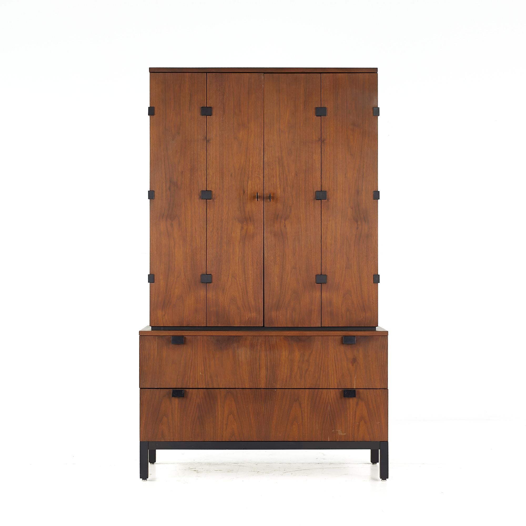 Milo Baughman for Directional mid century walnut highboy armoire

The bottom of the highboy measures: 40 wide x 18 deep x 24.25 inches high
The top of the highboy measures: 37 wide x 15.5 deep x 42.5 inches high
The combined height is