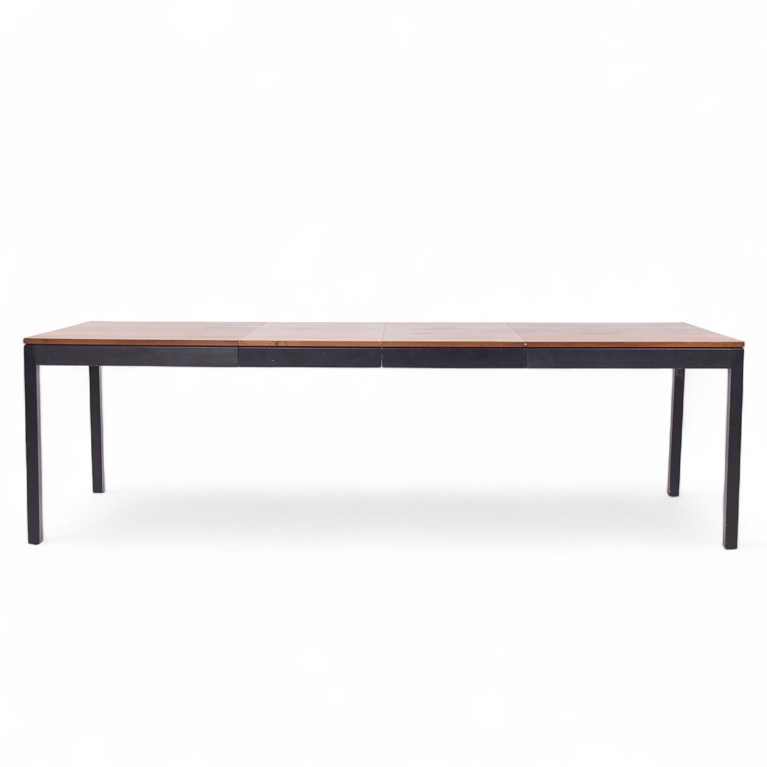 Milo Baughman for Directional Mid Century Rosewood, Walnut and Ash Expanding Dining Table with 2 Leaves

This table measures: 60 wide x 38 deep x 29.5 inches high, with a chair clearance of 25.75 inches, each leaf measures 20 inches wide, making a