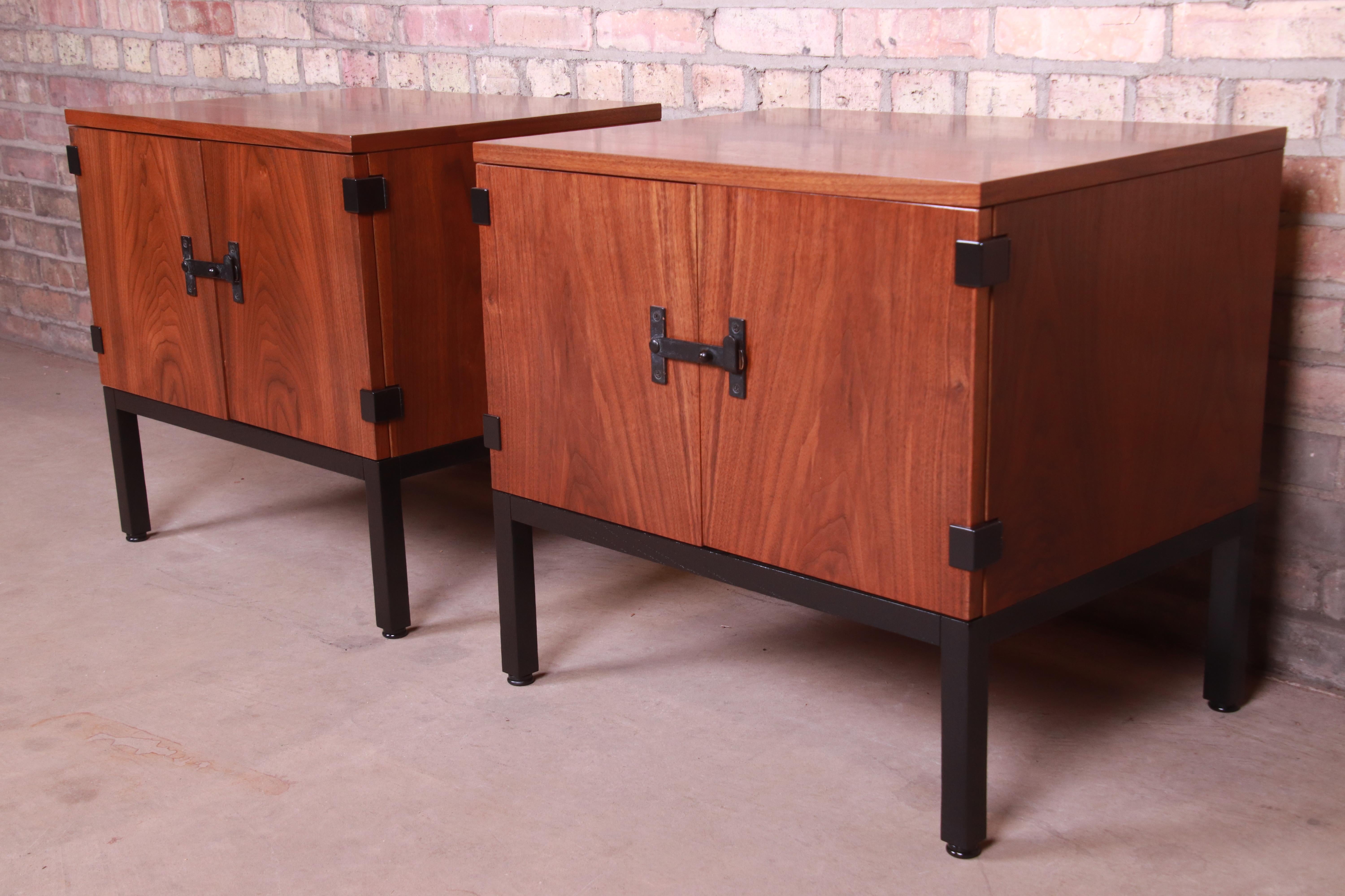 An exceptional pair of Mid-Century Modern nightstands

By Milo Baughman for Directional

USA, 1960s

Bookmatched walnut, with ebonized legs and accents and original hardware.

Measures: 24.25