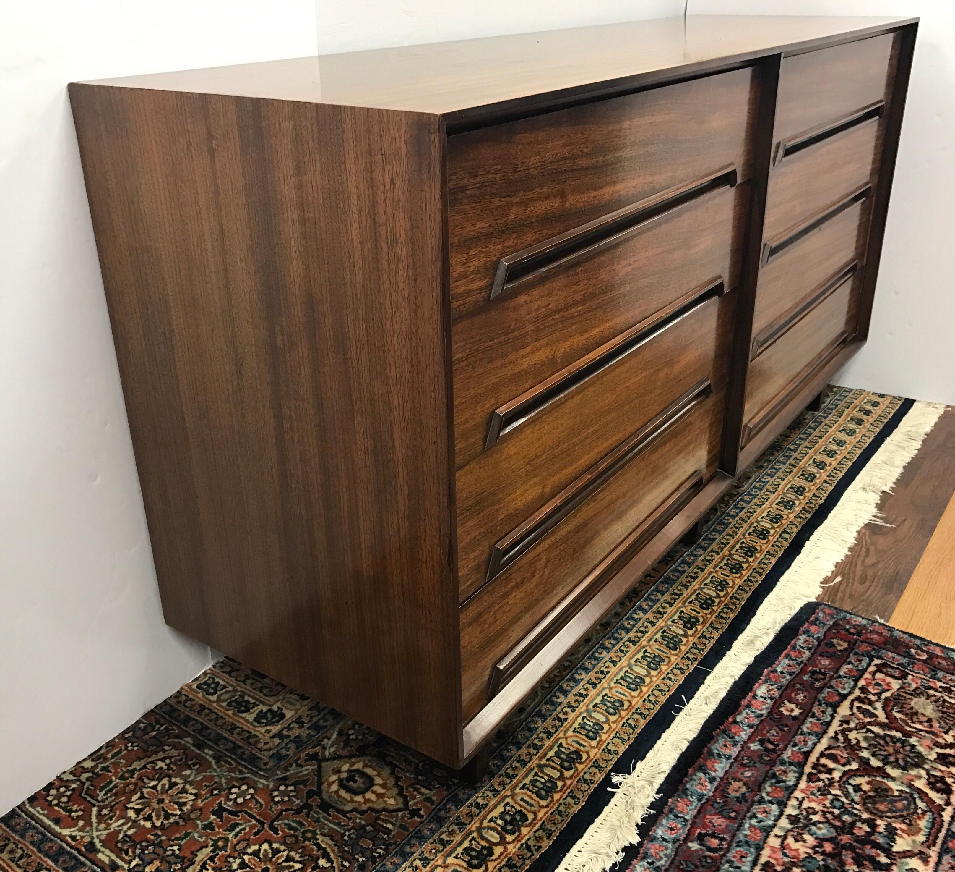 Rosewood and mahogany Milo Baughman designed large eight-drawer dresser for Drexel Perspective.
This is some of Baughman's earlier design work and a Mid-Century Modern Classic.