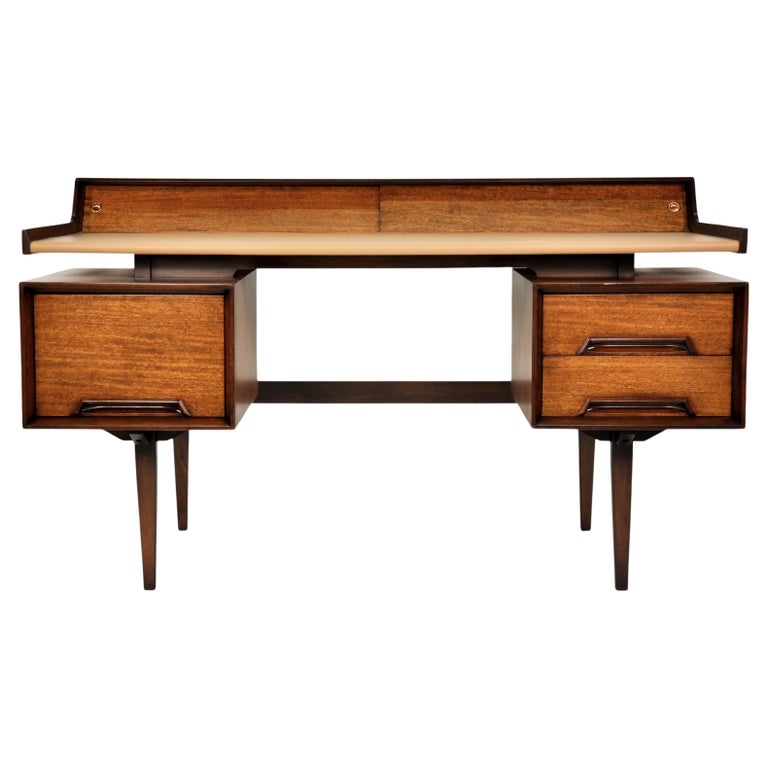 A stunning example of the rare Mid-Century Modern floating top desk from the Perspective collection Milo Baughman designed for Drexel in 1951. Of gleaming and exotic Mindoro wood imported from the Philippines, it features a floating top with cubbies