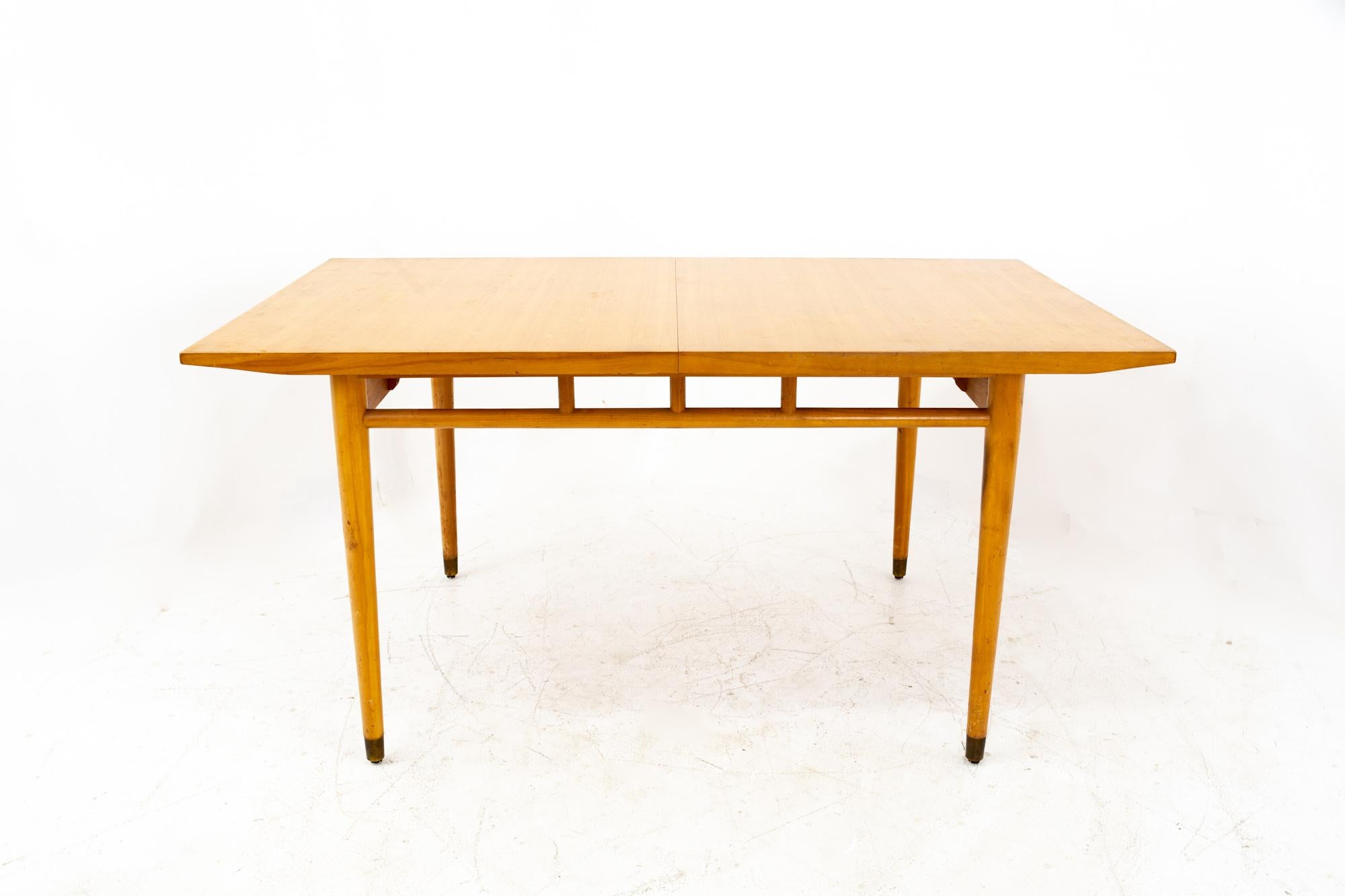 Drexel New Todays living Mid Century blonde dining table

This table measures: 61.5 wide x 40 deep x 29.5 high, with a chair height of 24 inches, each leaf is 12 wide, making the maximum table width 85.5 inches when both leaves are used.

This piece