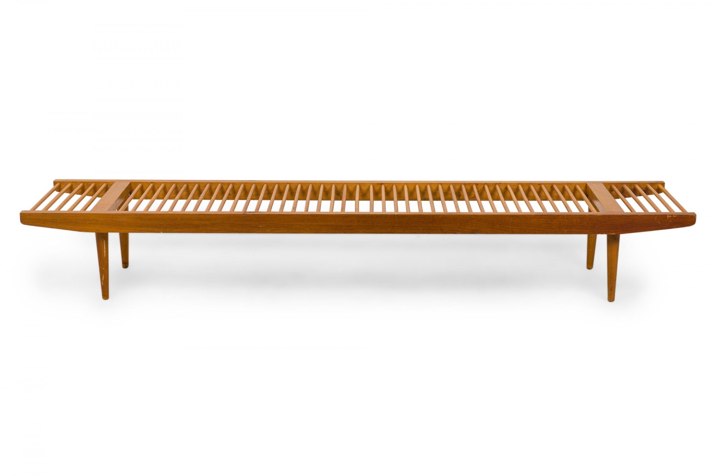 American Mid-Century rectangular 'dowel' bench with a light wood frame and a seat made of dowel slats. (MILO BAUGHMAN FOR GLENN OF CALIFORNIA)(Similar bench: DF0640)
