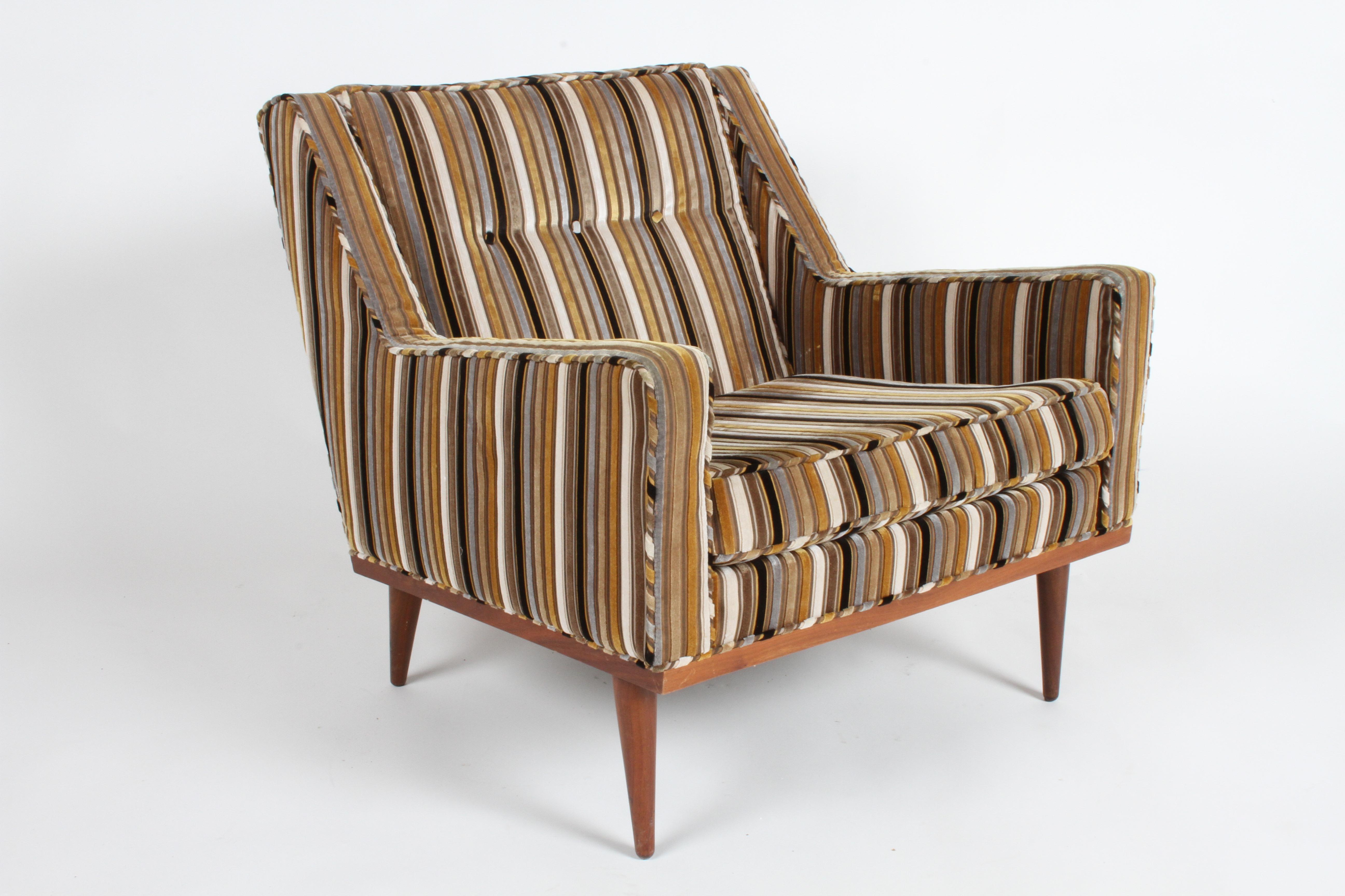 Milo Baughman for James Inc. low back lounge chair, part of his articulate seating collection with classic Mid-Century lines. This chair has its original wide velvet stripe upholstery and walnut finished frame. Upholstery is in surprisingly good