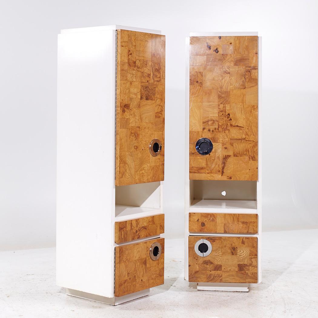 Milo Baughman for Lane Mid Century White Lacquer and Burlwood Armories - Pair

Each armoire measures: 20 wide x 20 deep x 68 inches high

We take our photos in a controlled lighting studio to show as much detail as possible. We do not Photoshop out