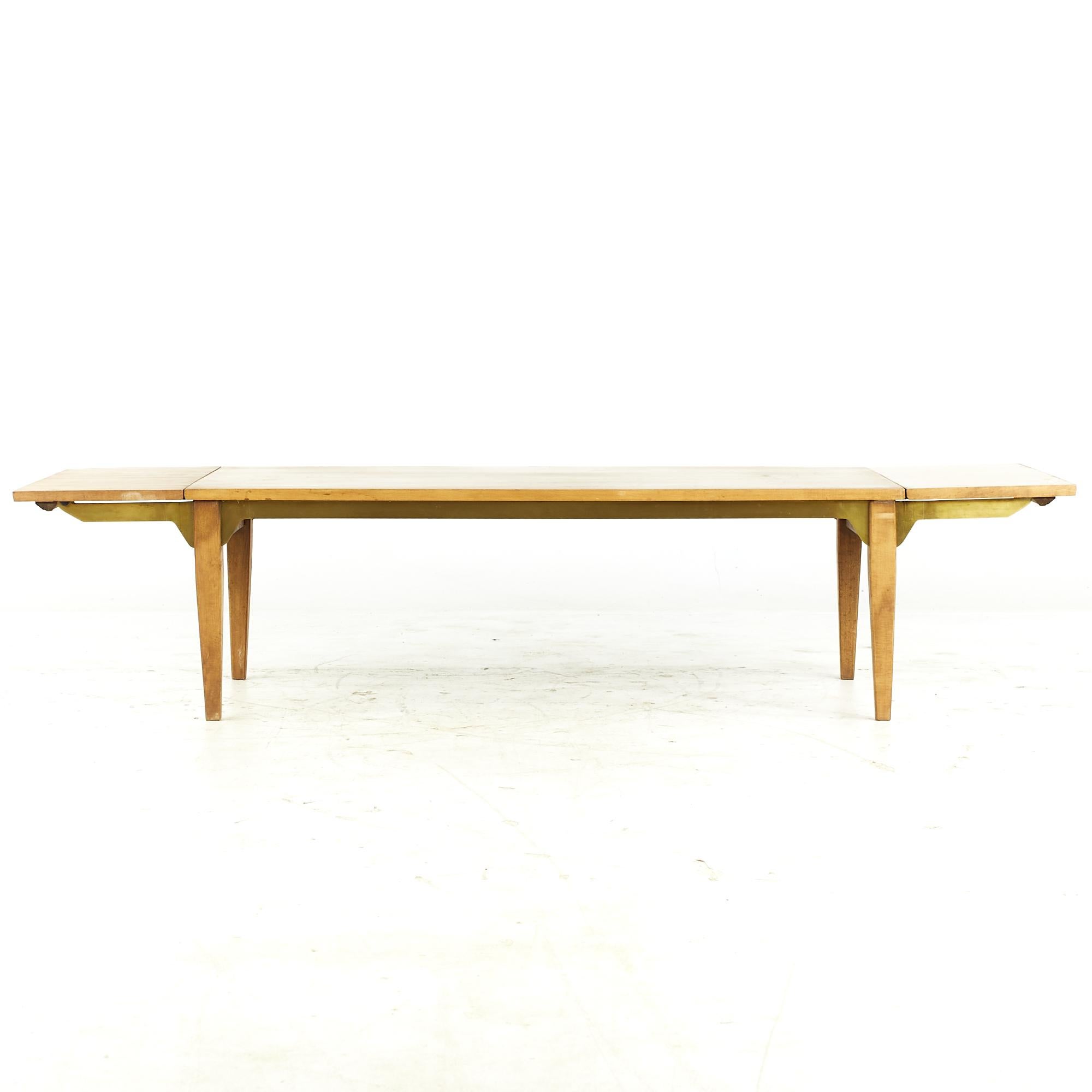 Milo Baughman for Murray midcentury Expanding Bench Brass Coffee Table

This coffee table measures: 46 wide x 22 deep x 15.25 inches high; each leaf is 11 inches wide, making a maximum table width of 68 inches when both leaves are expanded

All
