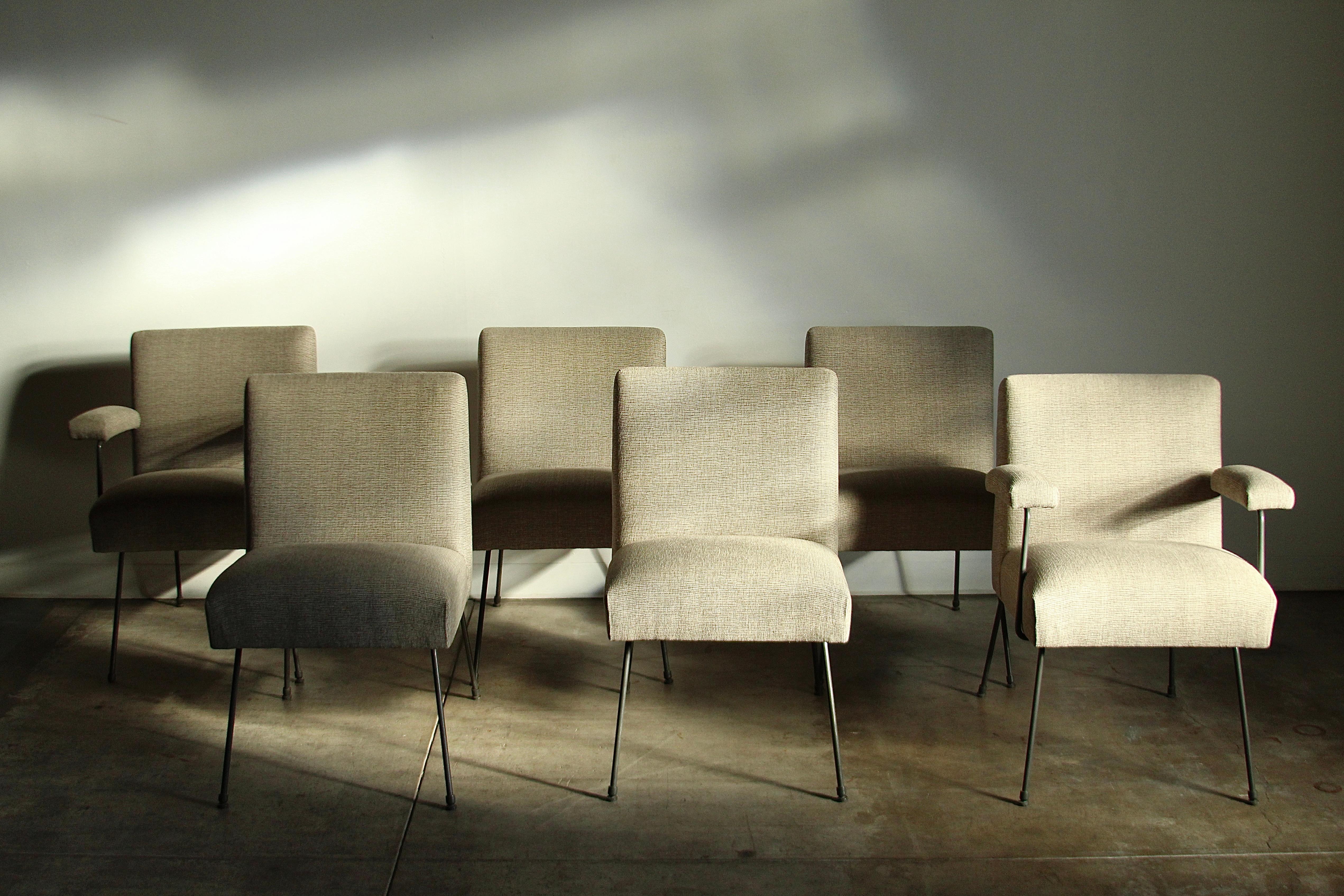 Set of 6 dining chairs designed by Milo Baughman and made by Pacific Iron Products in the 1950s. The chairs feature charcoal gray iron frames and striated oatmeal fabric. The seats are soft and cushy and so so comfortable. Overall the chairs are in