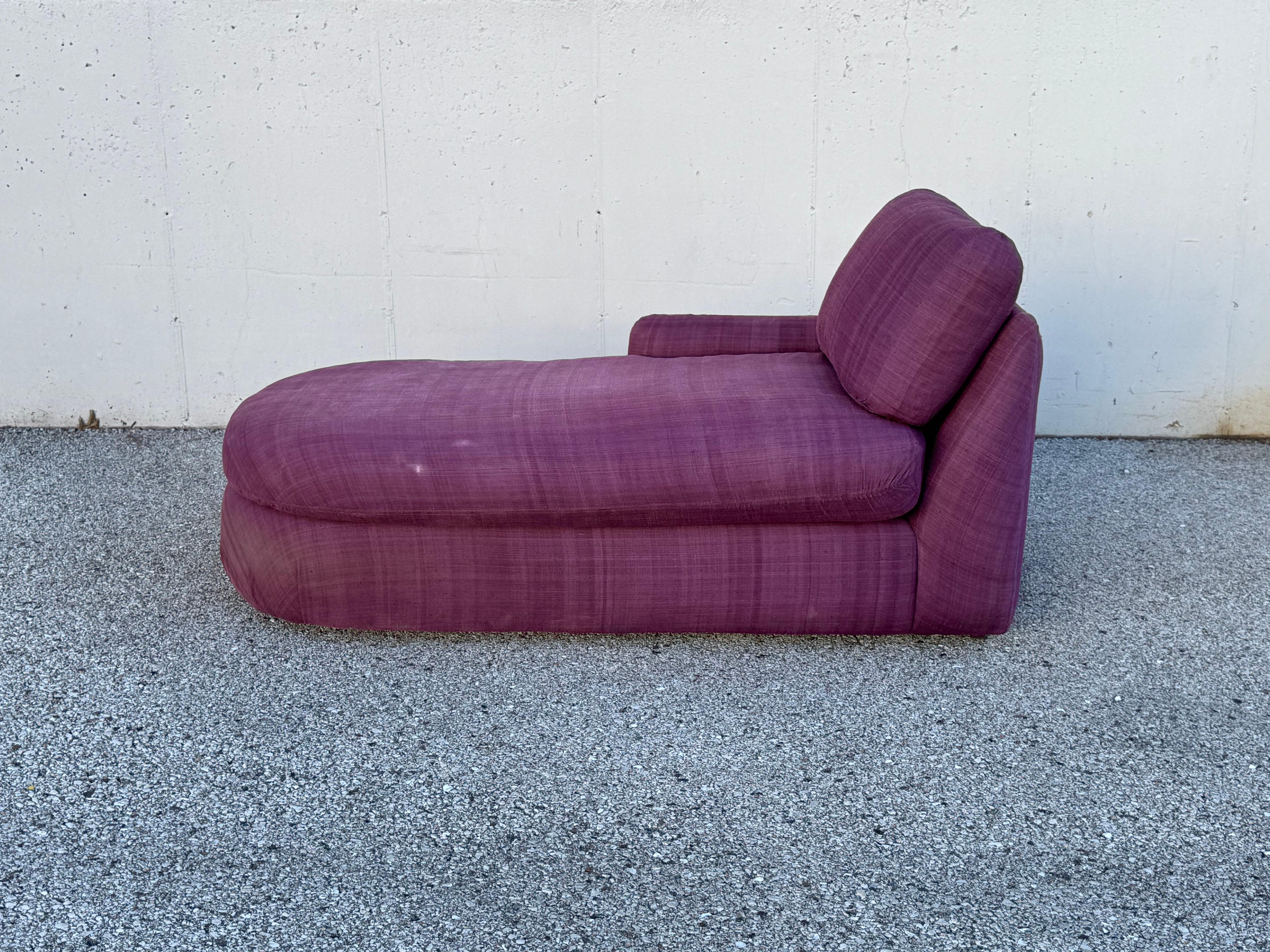 1980s Post Modern design by Milo Baughman for Thayer-Coggin , one arm chaise fully upholstered in original plum linen, with comfy down cushions on four minimal rectangular wood feet.  Rounded form or capsule or pill shaped chaise / sofa, (model #