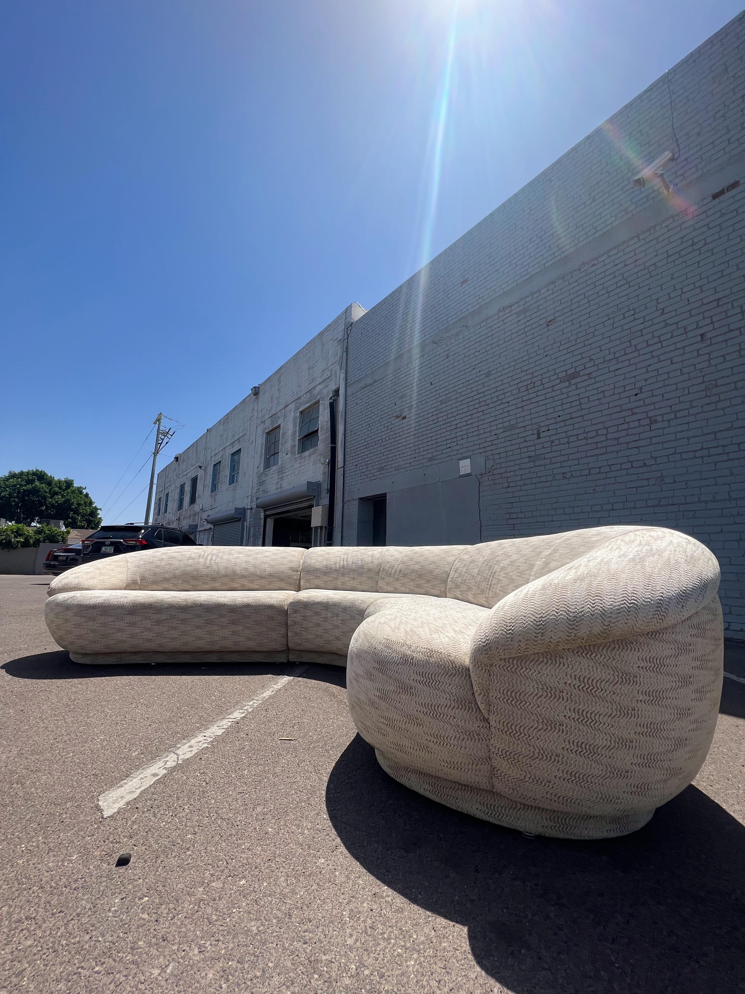 Curved three-piece sectional by Milo Baughman for Thayer Coggin. 

Gracing us in an incredible textured earth-tone upholstery, fresh out the shower (back from cleaning.)

Measuring a monumental 9’ each direction, approx. 12.5’ diagonally, with