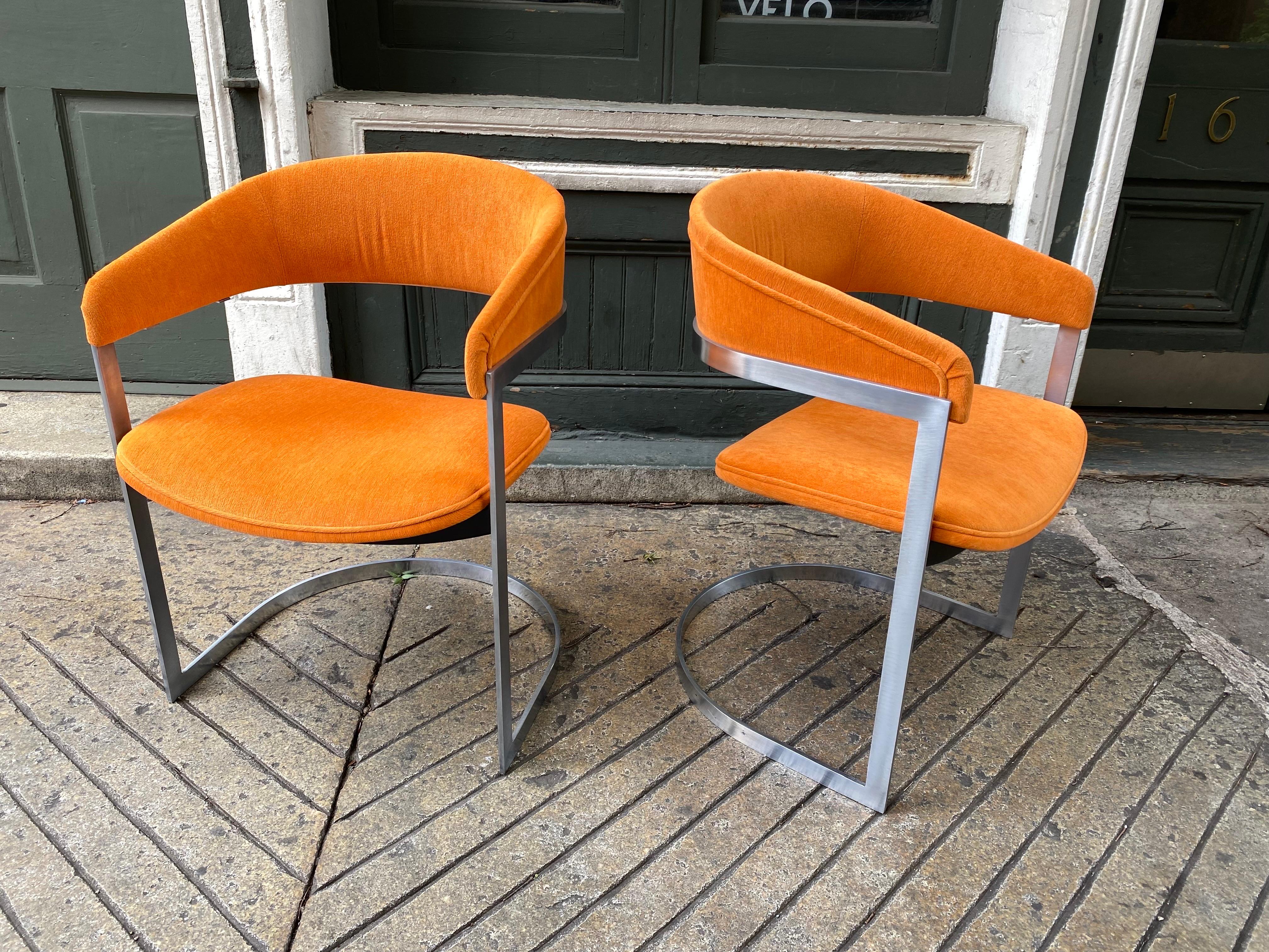 Aluminum chairs with orange upholstery, in the style of Milo Baughman for Thayer Coggin. Reupholstered in the last couple of years. Stylist and Comfortable! Aluminum is very clean! Perfect for that extra seating when company comes over or with a