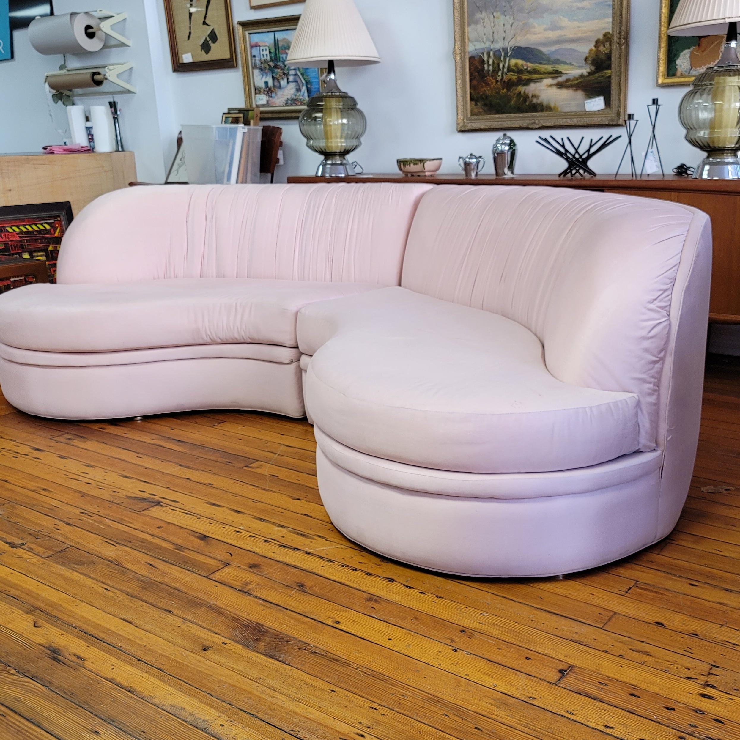 This stunning pink sofa designed by Milo Baughman is tagged with the Thayer Coggin label. The original uphoulstery is in average condition for its age with a few stains and small holes as shown in photos. The two-piece sectional has been