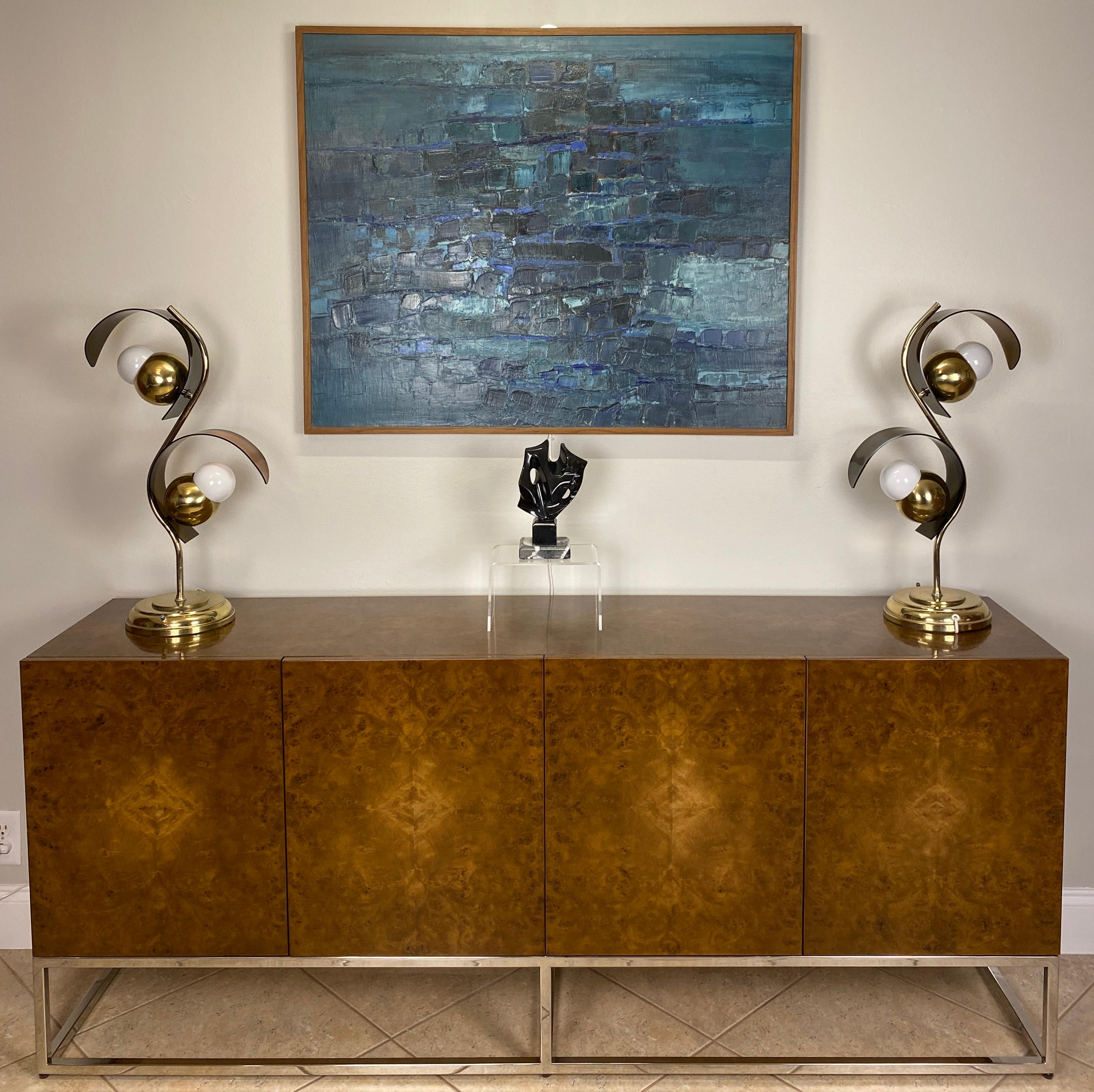 Milo Baughman design burl wood credenza or sideboard. 

This stylish credenza has a very good quality finish. It is very high quality and well crafted. 
There is a beautiful burl wood figuring throughout the exterior and interior of the cabinet
