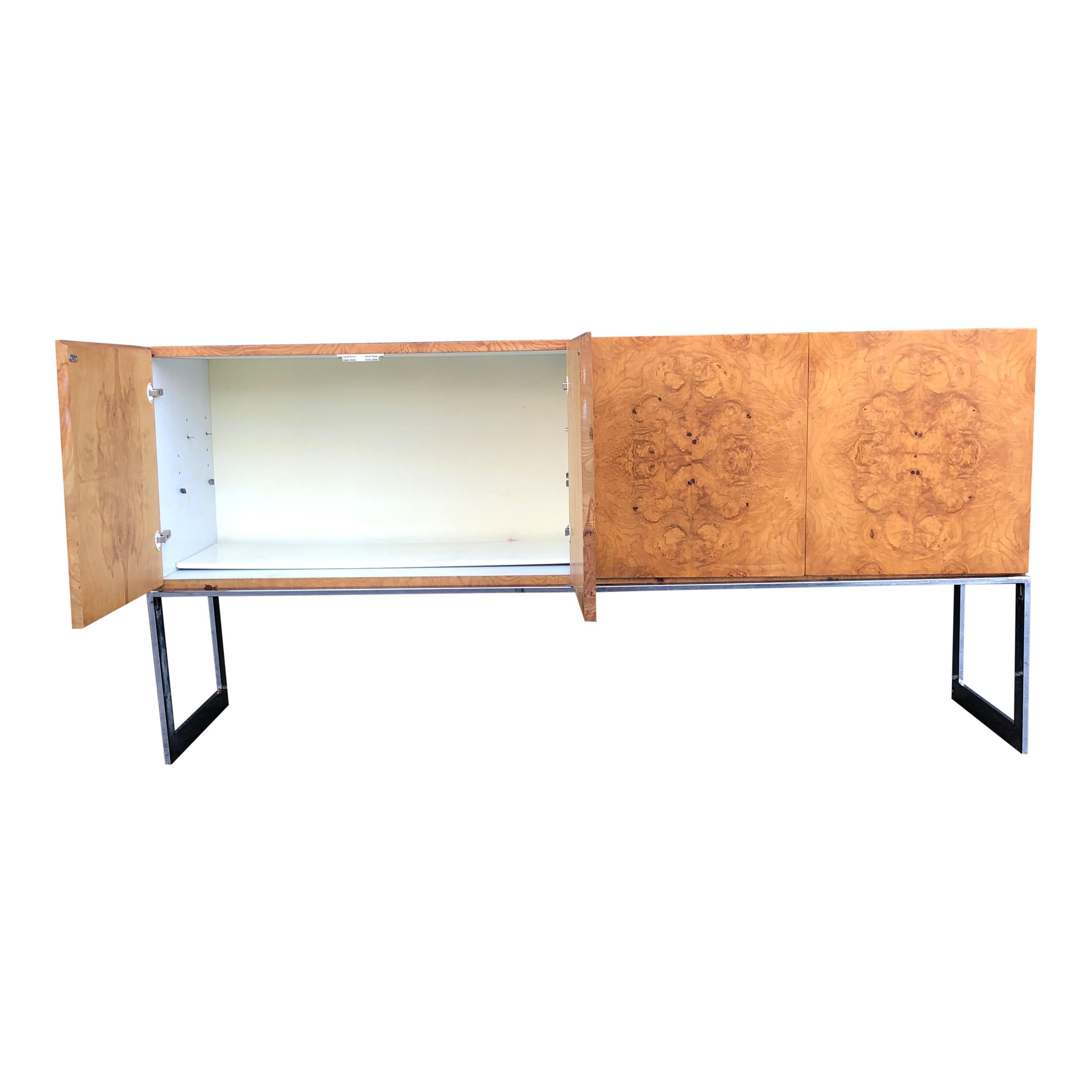 For sale is a beautiful Milo Baughman for Thayer Coggin Sideboard/credenza in bookmatched olive burl wood veener on a chrome base. 

The piece is a beautiful mod/1970s statement piece from one of the masters of American design. 

The side board