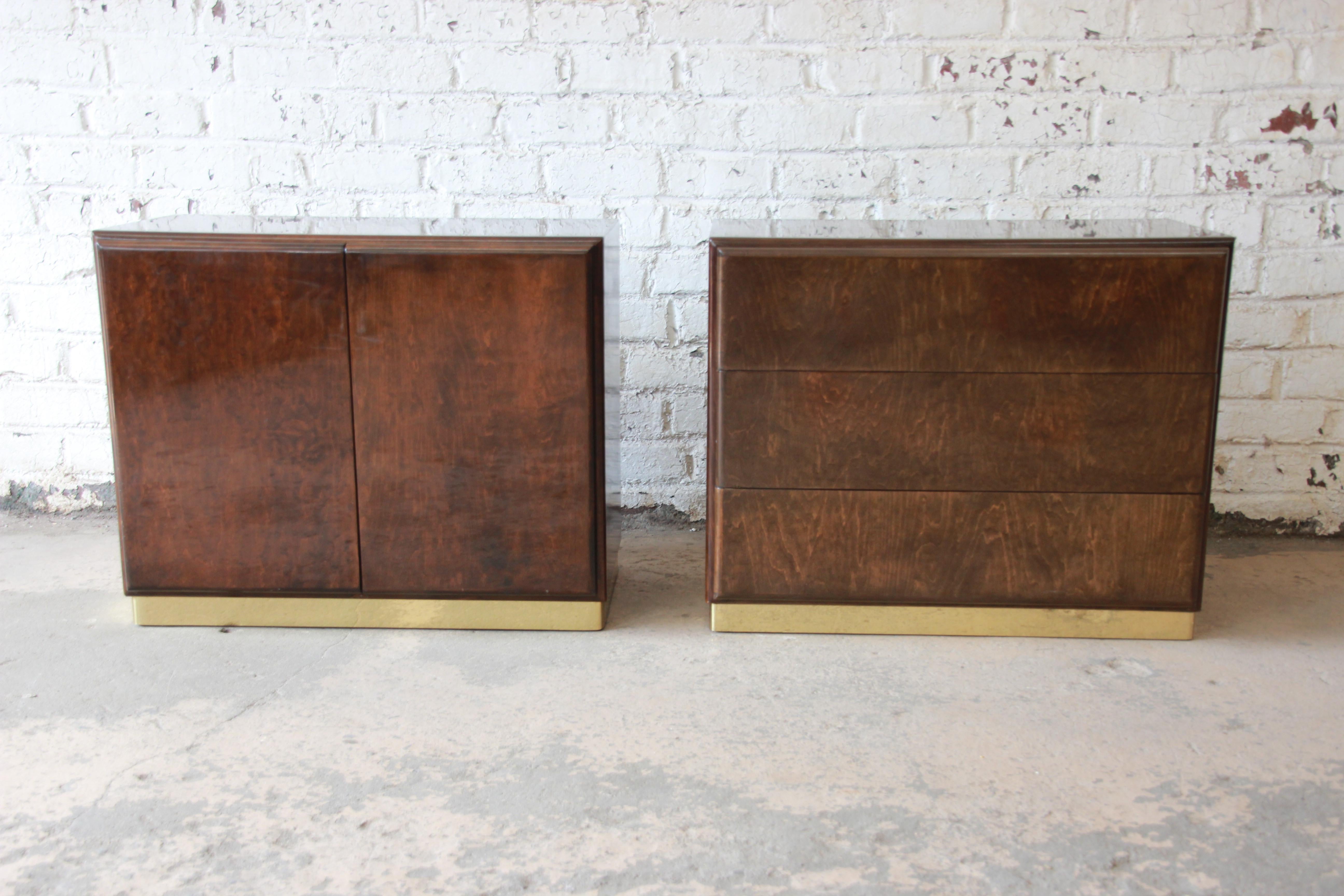 Offering an exceptional and unique pair of nightstands or side tables by Milo Baughman for Thayer Coggin. The nightstands feature gorgeous burled wood grain and sleek Mid-Century Modern design. The cases rest on brass plinth bases. The set includes