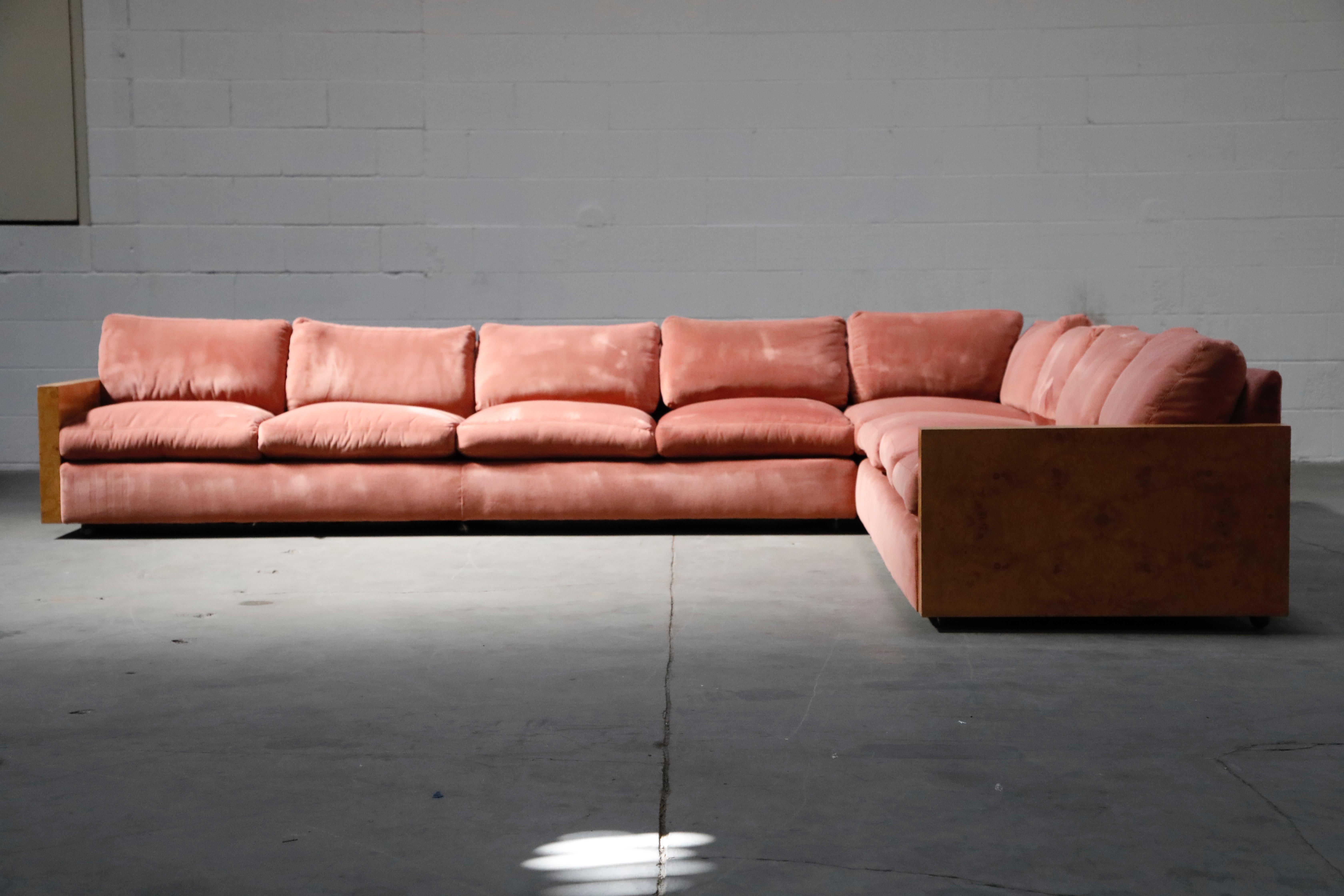 This must-have sectional sofa set is by Milo Baughman for Thayer Coggin, featuring soft luxurious pink velvet with burled wood arms, and in an incredibly spacious size, this is the perfect entertainment couch for any pad, studio, boutique or