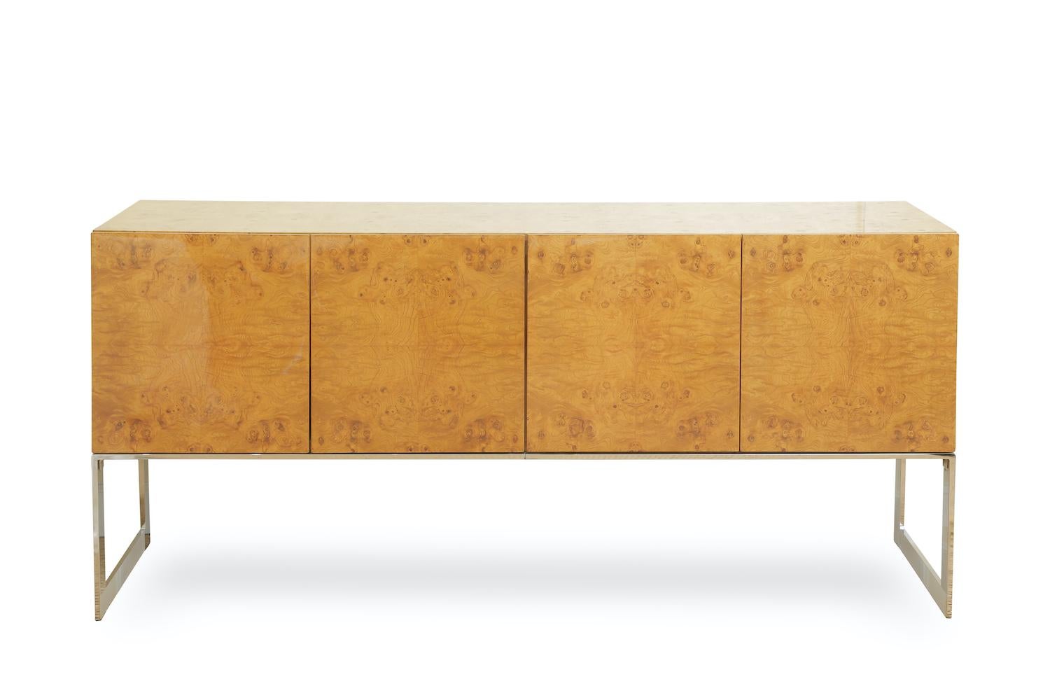 This absolutely gorgeous vintage Milo Baughman for Thayer Coggin cabinet, buffet and or credenza has been fully restored from top to bottom. The wood is exquisite and is a burled olive wood. It almost looks like 4 abstract faces on the front from