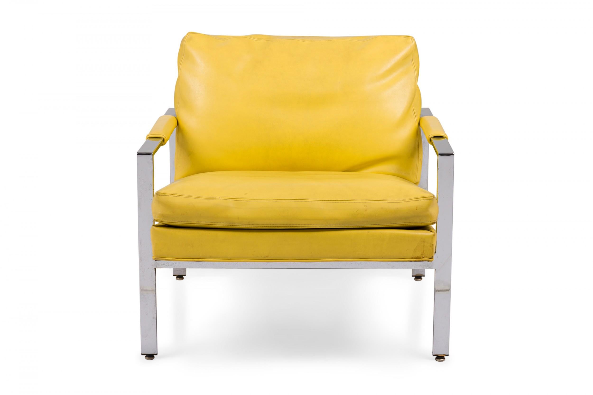 American Mid-Century lounge armchair with a polished chrome flat bar frame, upholstered in bright yellow vinyl. (MILO BAUGHMAN FOR THAYER COGGIN).
 