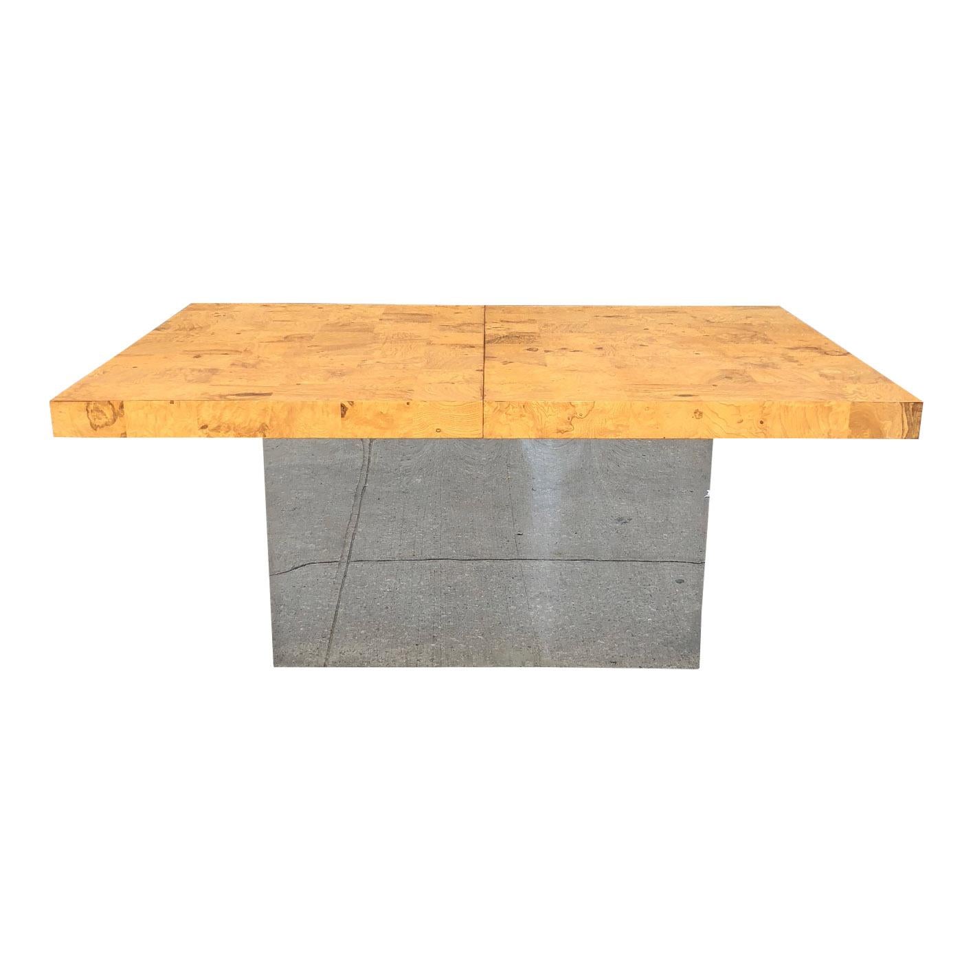 For your consideration is a striking midcentury dining table by Milo Baughman for Thayer Coggin.

The table sits atop a highly-reflective chrome base. The top is a pastiche of patchwork burl wood.

Measures: H 29.5 in. x W 44 in. x D 66 in.

The