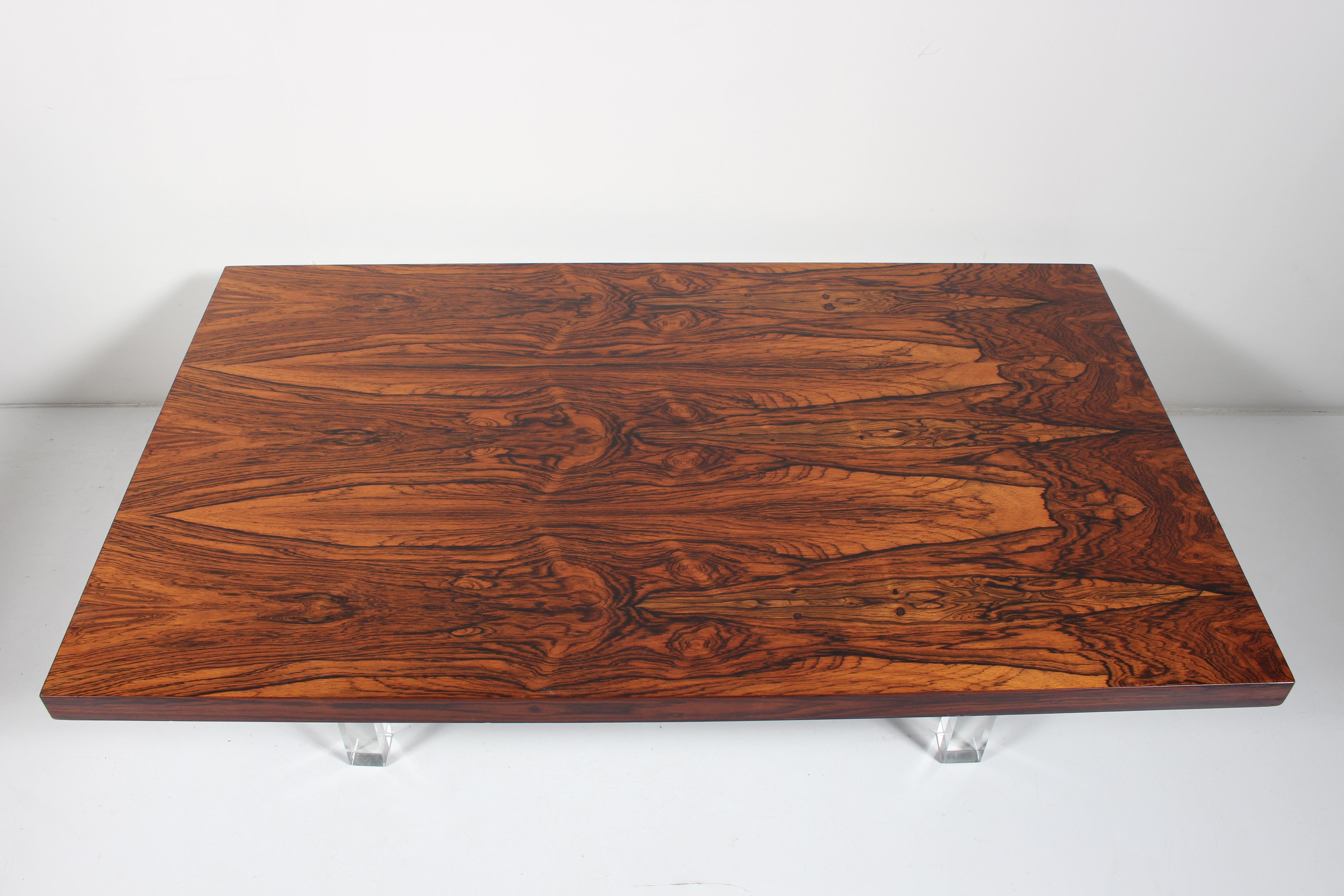 Milo Baughman for Thayer Coggin Brazilian Rosewood Coffee Table, 1960s 
Featuring a finely crafted rectangular book-matched grain Rosewood, raised on four square, balanced and solid transparent lucite legs. Perfect for a Modern environment. WIth