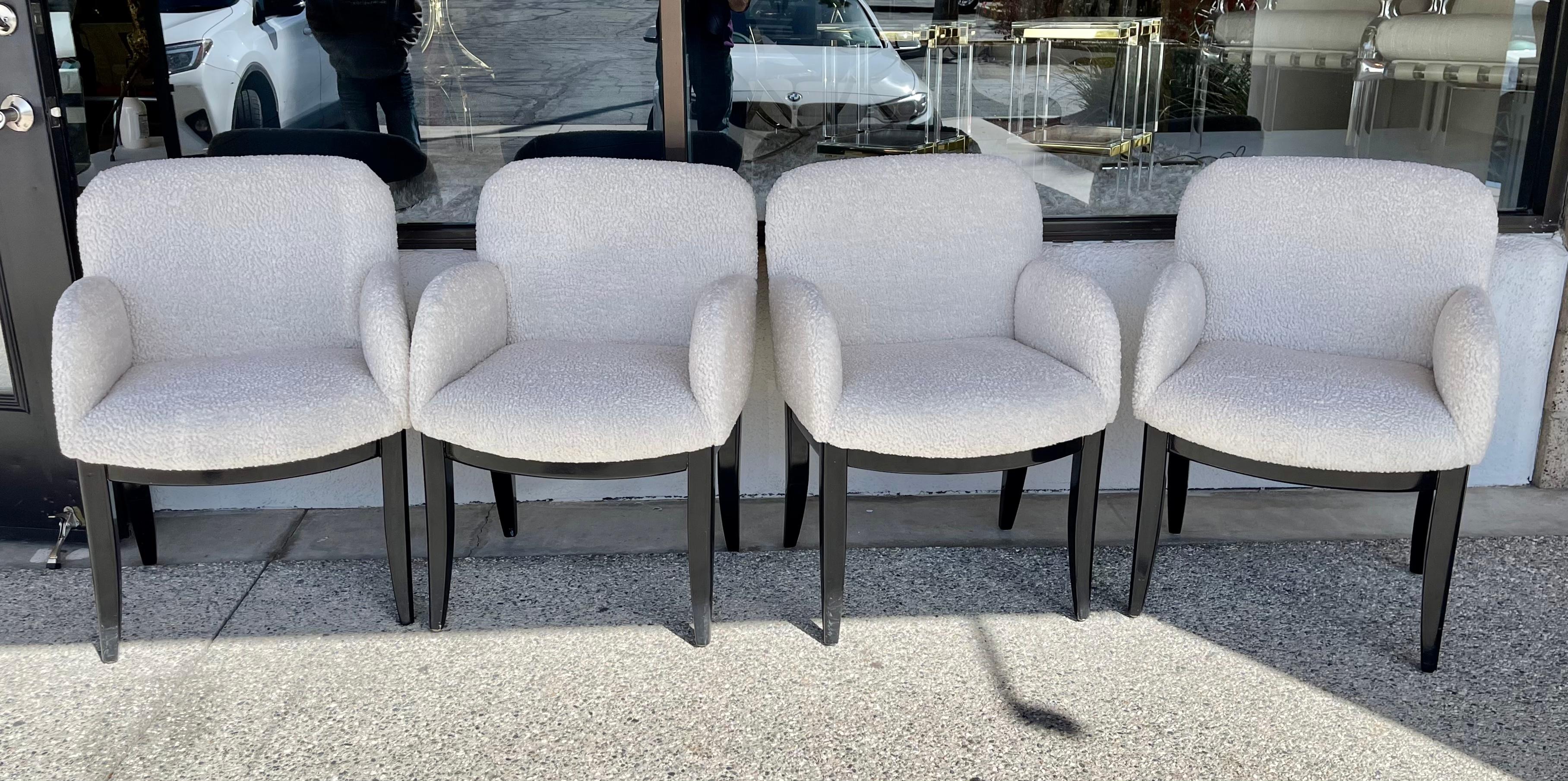 A set of 4 dining chairs designed by Milo Baughman for Thayer Coggin. These have been re-upholstered in a Faux Sheepskin Italian synthetic nubby fabric. The legs are a glossy black. They each have the Thayer Coggin label. Likely from the 1980's. The
